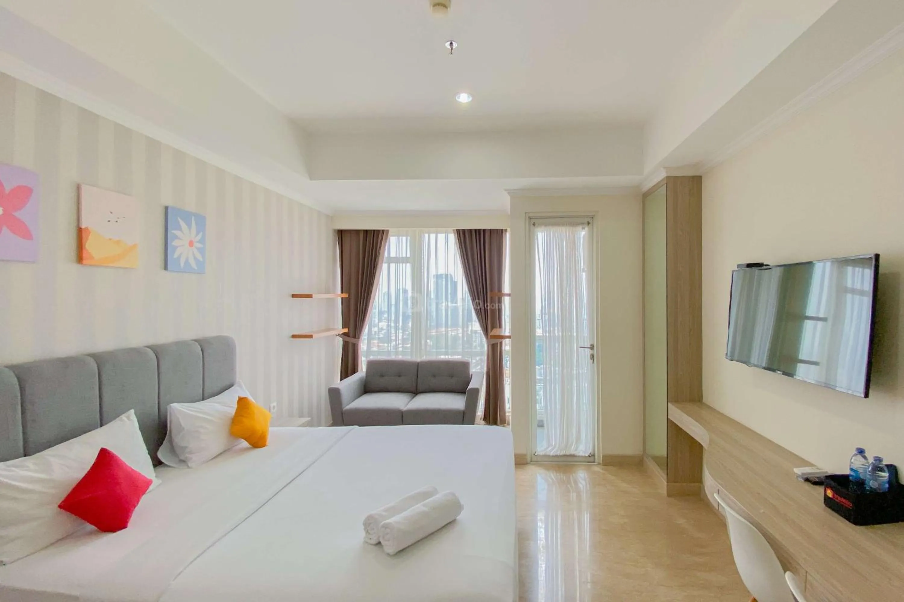 Bed in Good Choice and Elegant Studio Menteng Park Apartment By Travelio