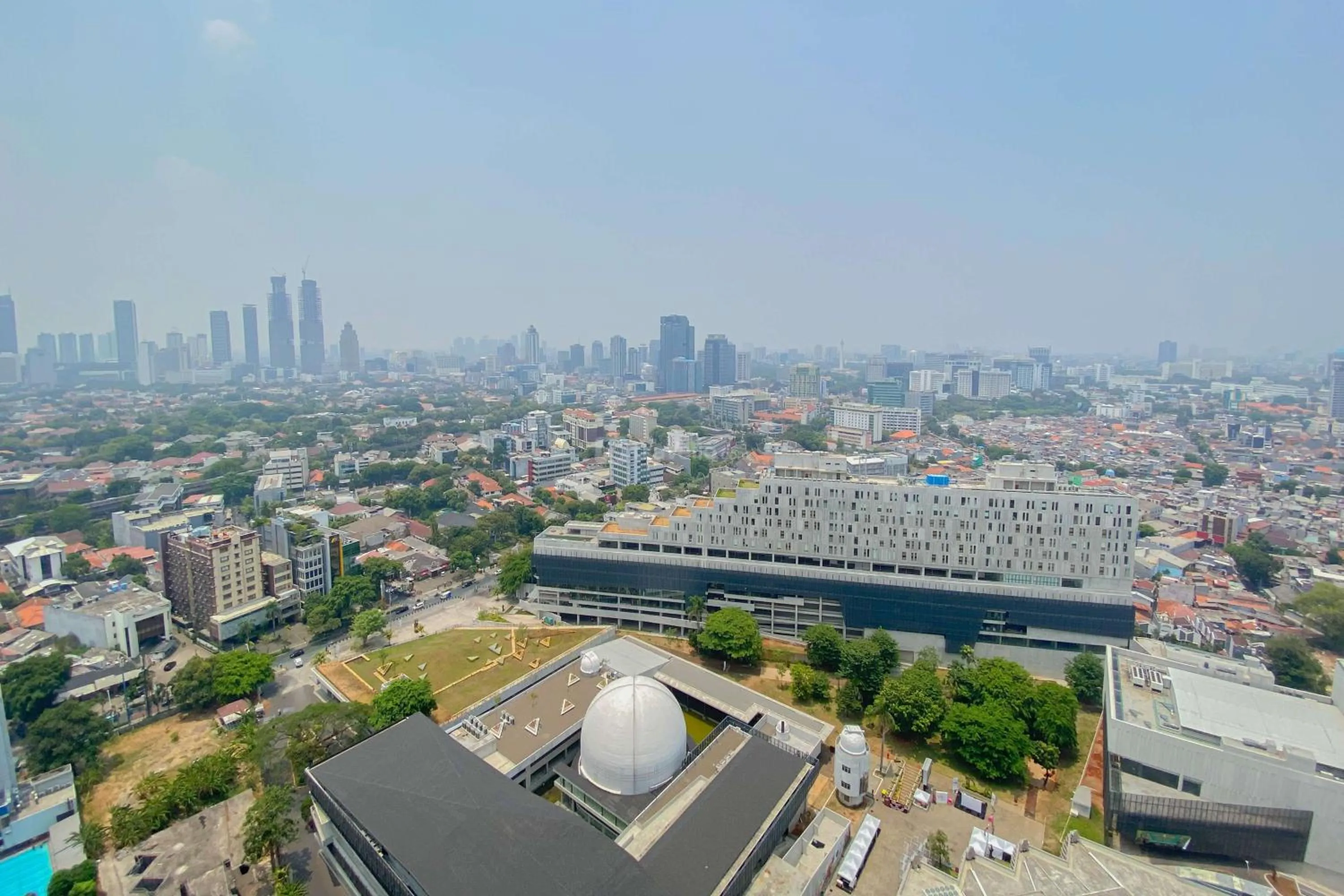 Bed in Good Choice and Elegant Studio Menteng Park Apartment By Travelio