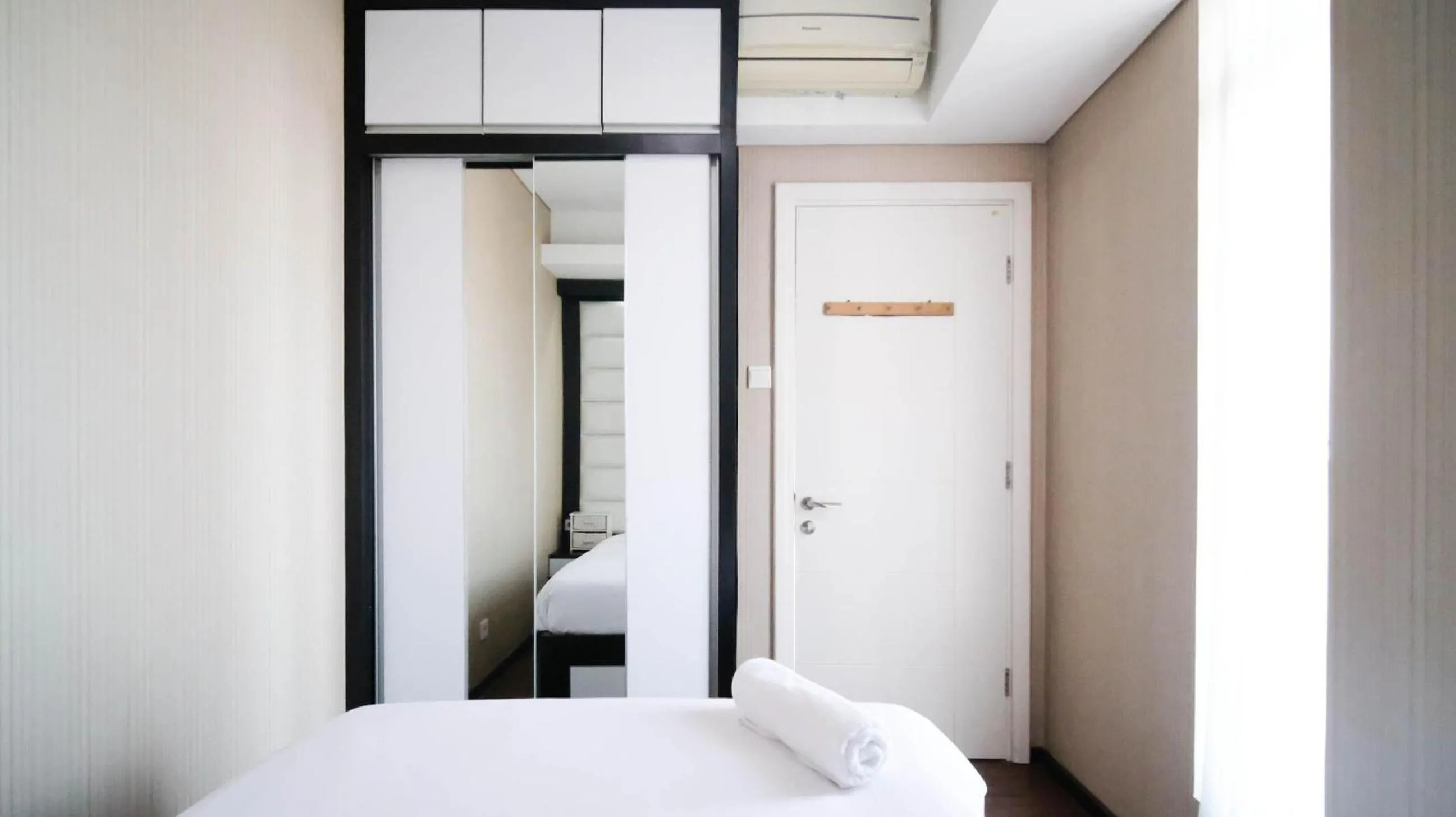 Bed in Strategic and Comfy 2BR Apartment at Trillium Residence By Travelio