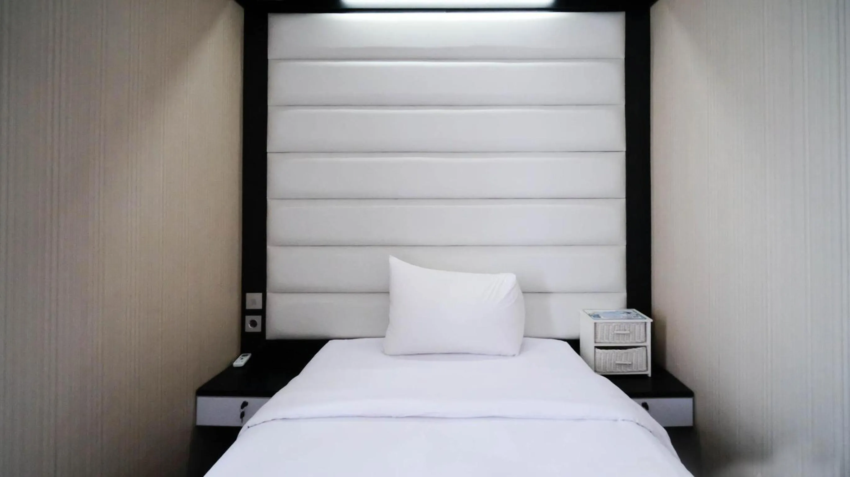 Bed in Strategic and Comfy 2BR Apartment at Trillium Residence By Travelio