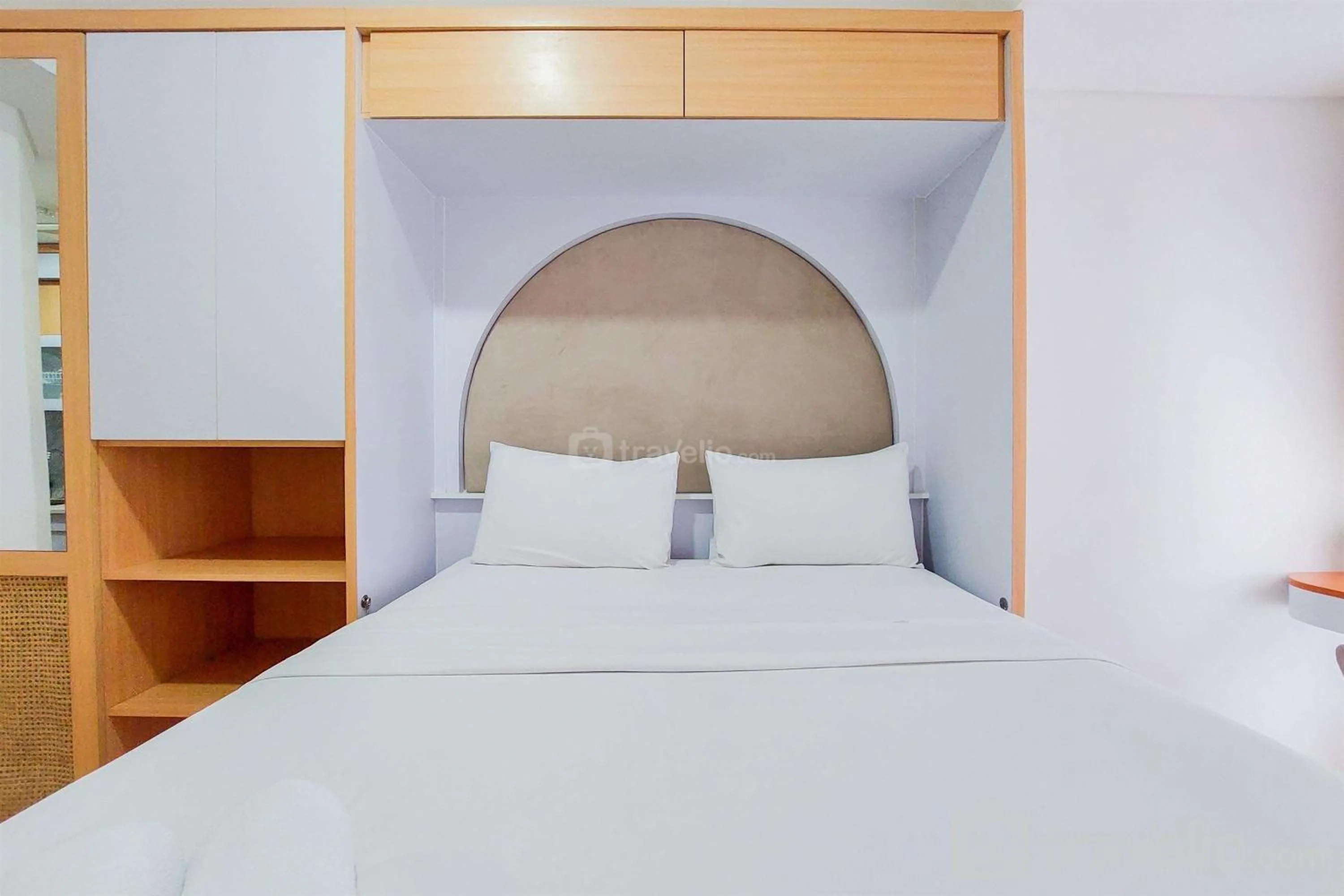 Bed in Minimalist Studio Room near Campus at Pacific Garden Alam Sutera Apartment By Travelio