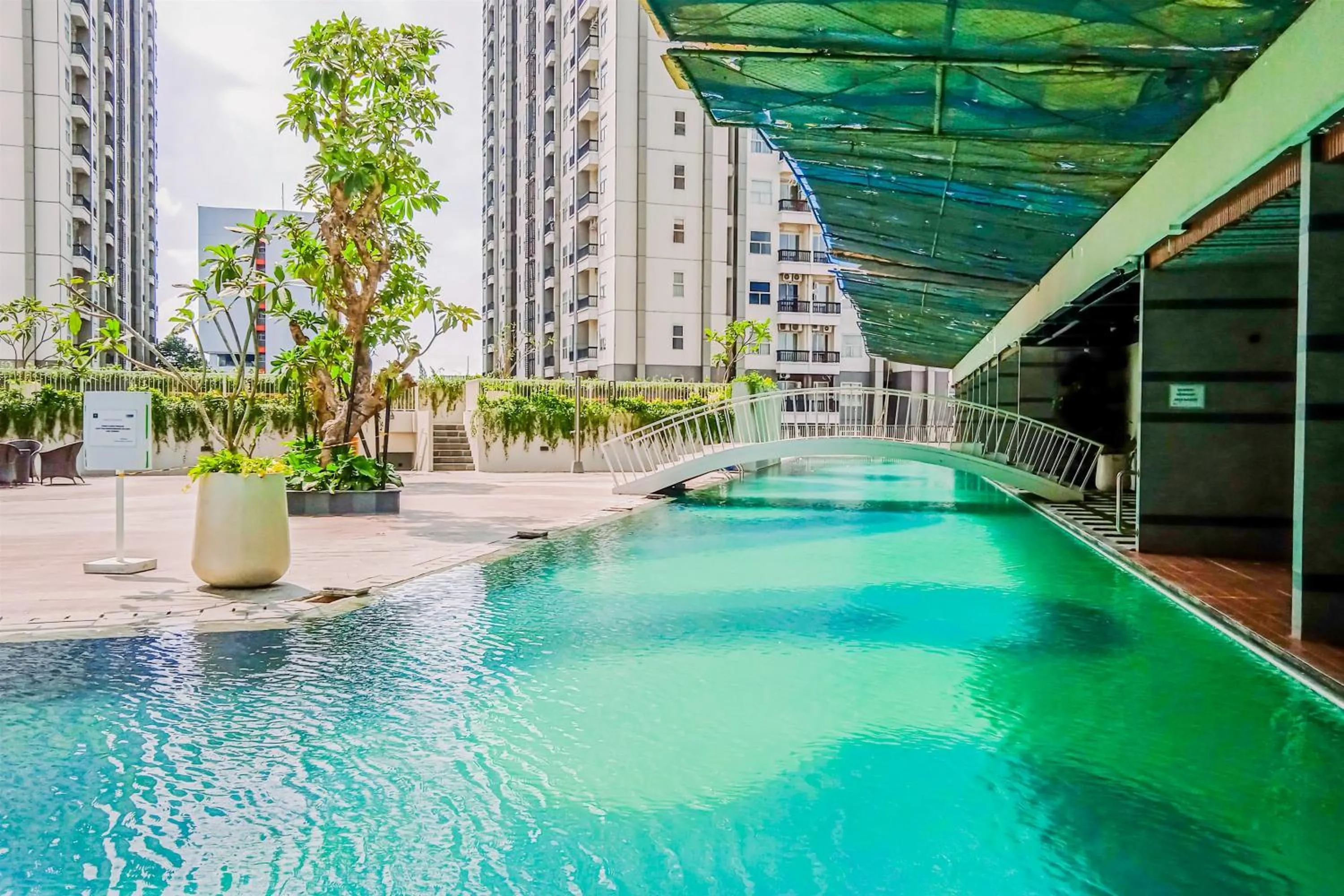 Minimalist Studio Room near Campus at Pacific Garden Alam Sutera Apartment By Travelio