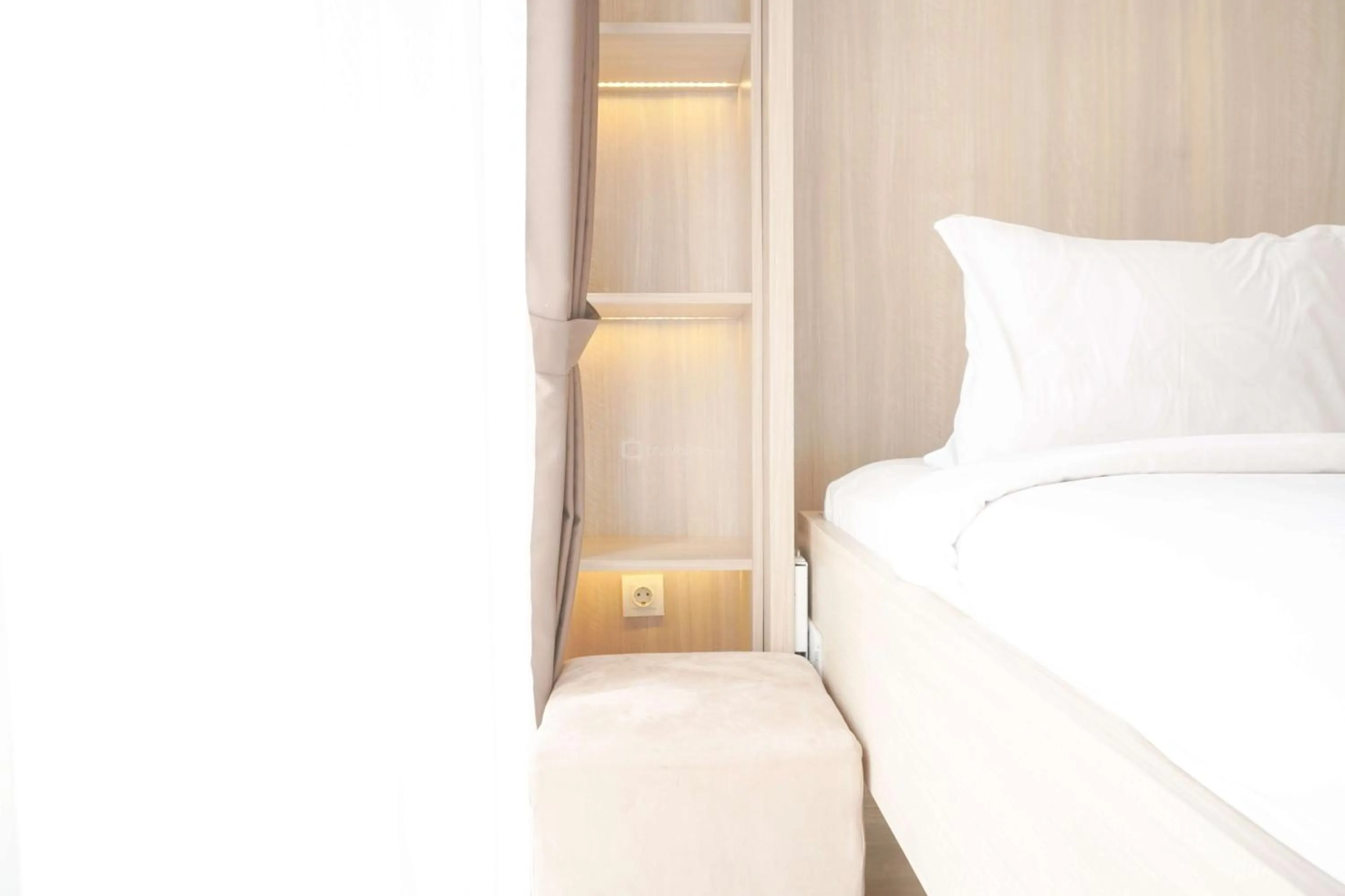 Bed in Best Choice and Nice Studio at Sky House BSD Apartment By Travelio