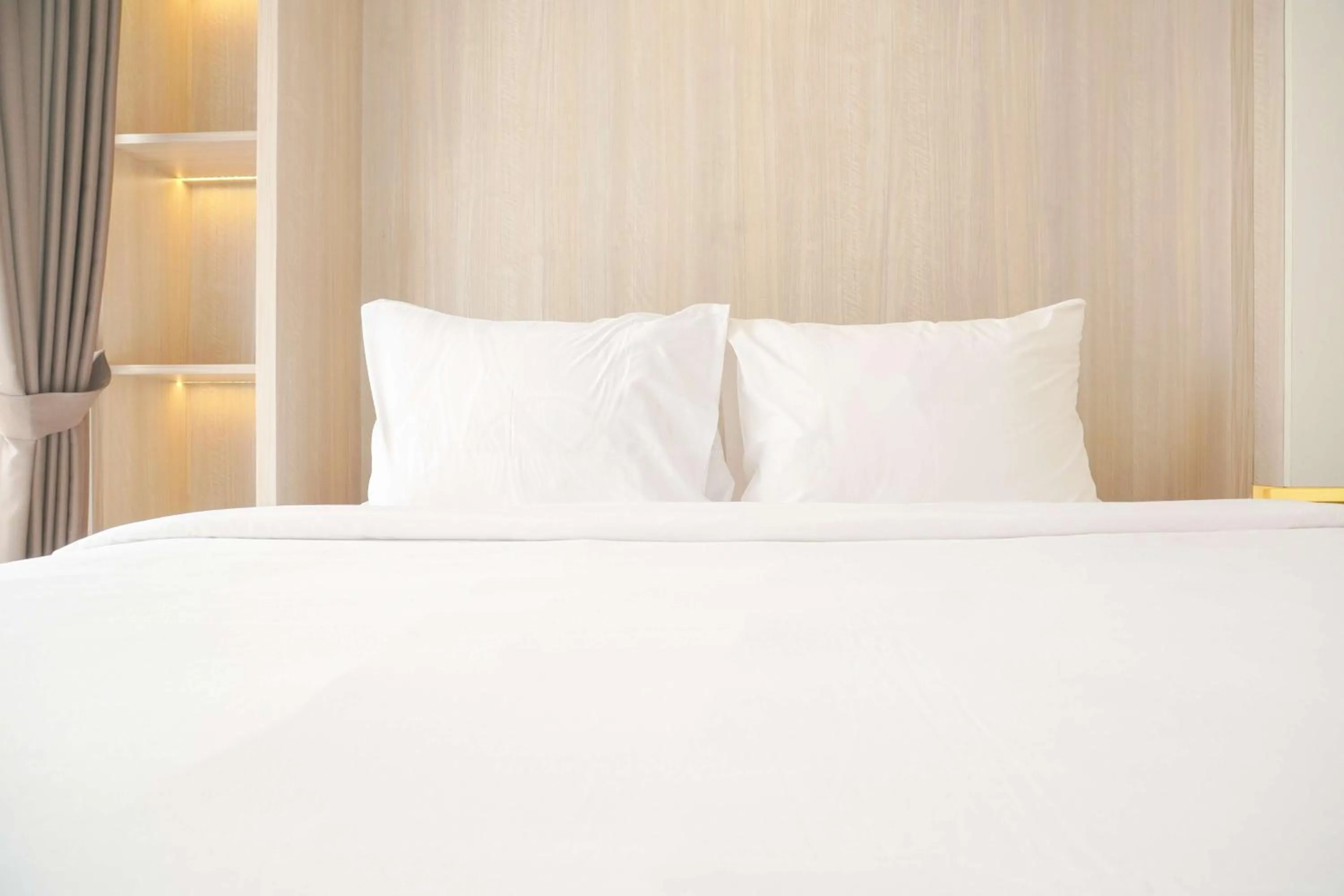 Bed in Best Choice and Nice Studio at Sky House BSD Apartment By Travelio