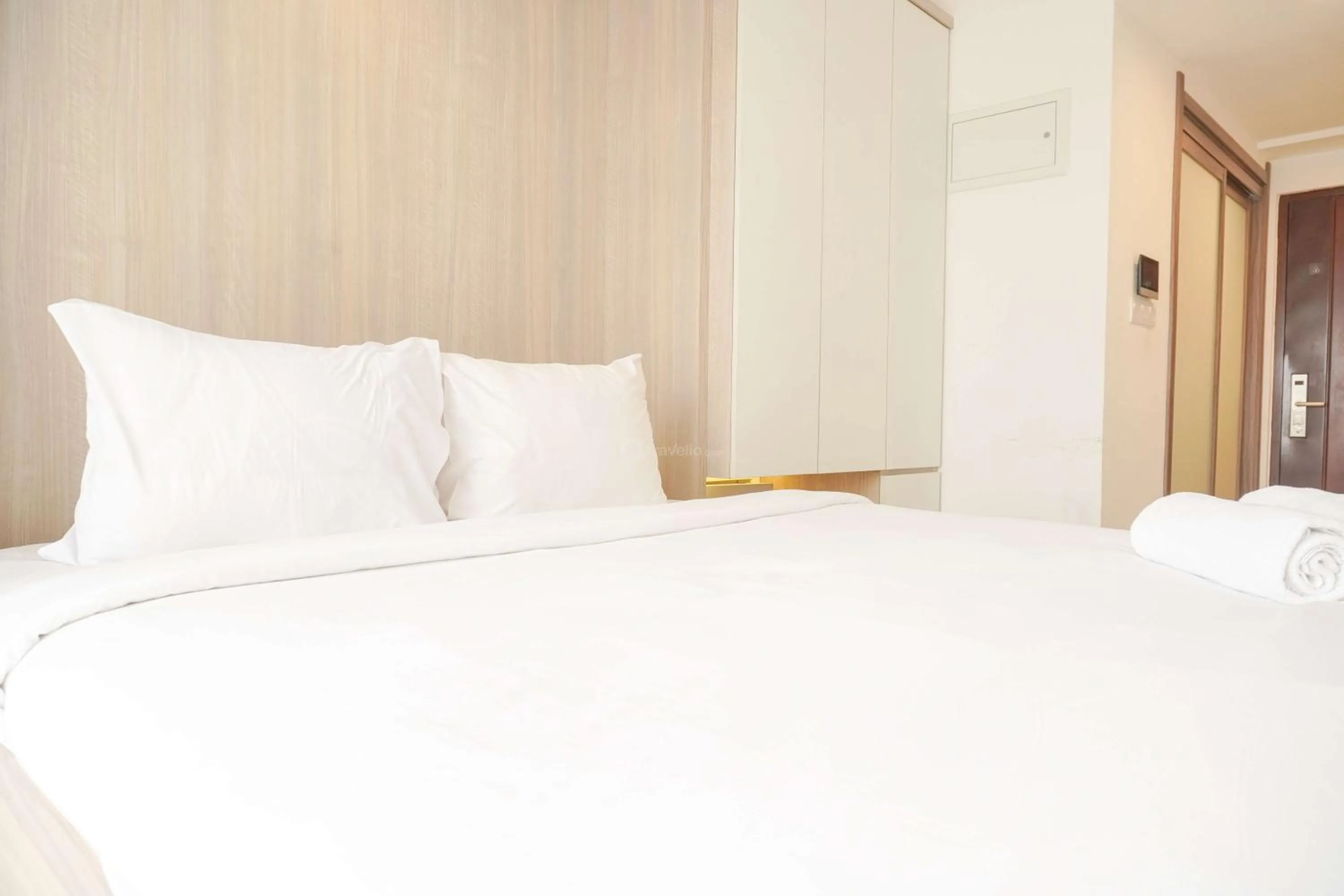 Bed in Best Choice and Nice Studio at Sky House BSD Apartment By Travelio