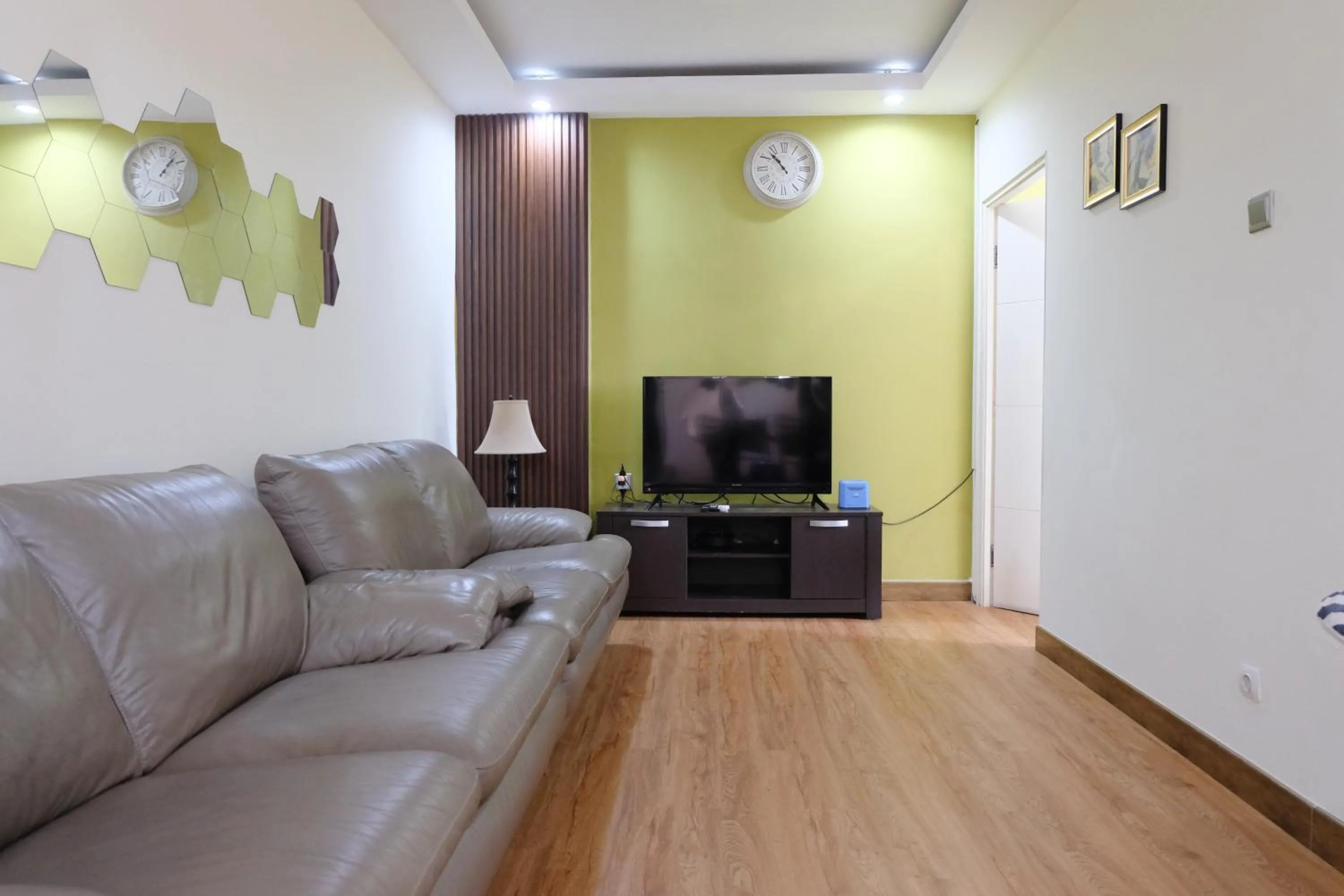 Living room in Spacious and Modern 3BR Apartment at Gateway Ahmad Yani Cicadas By Travelio
