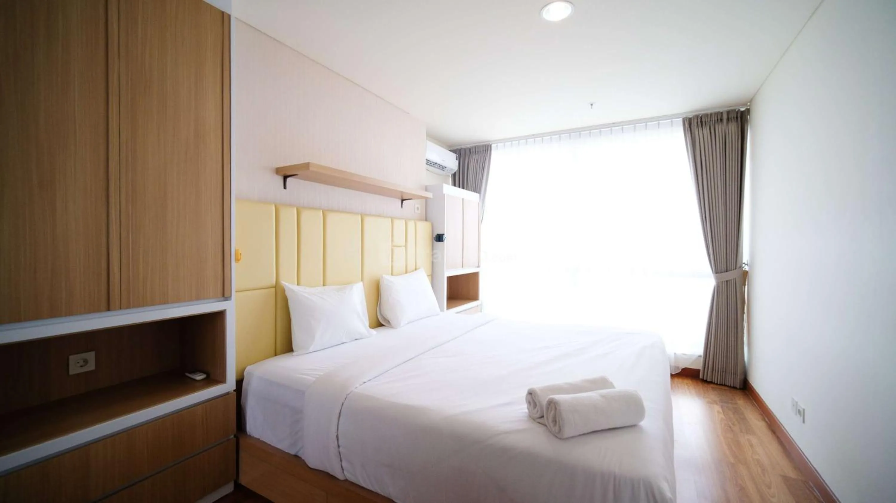 Bed in Best Location and Strategic 2BR at Praxis Apartment By Travelio