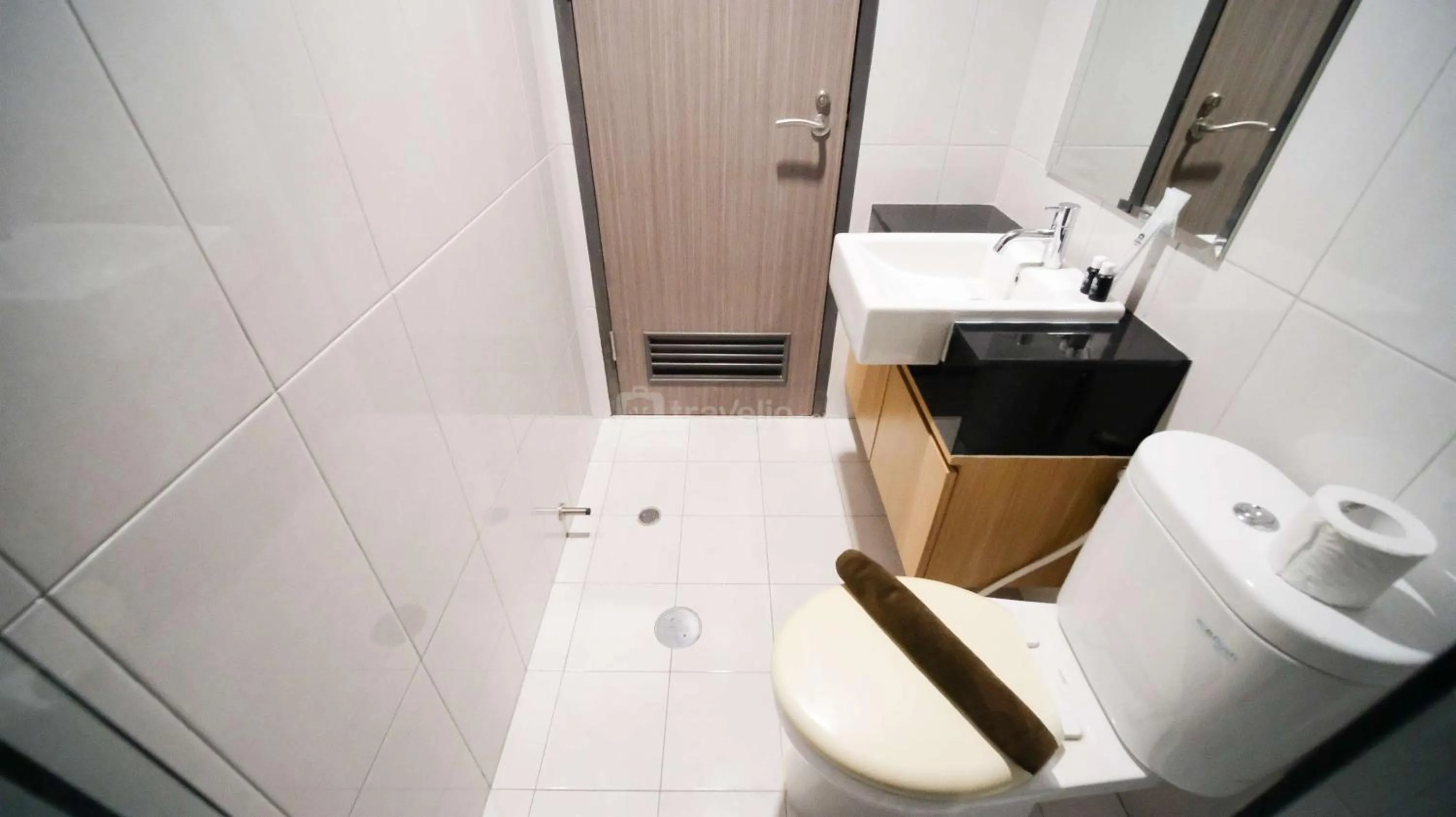Bed in Best Location and Strategic 2BR at Praxis Apartment By Travelio