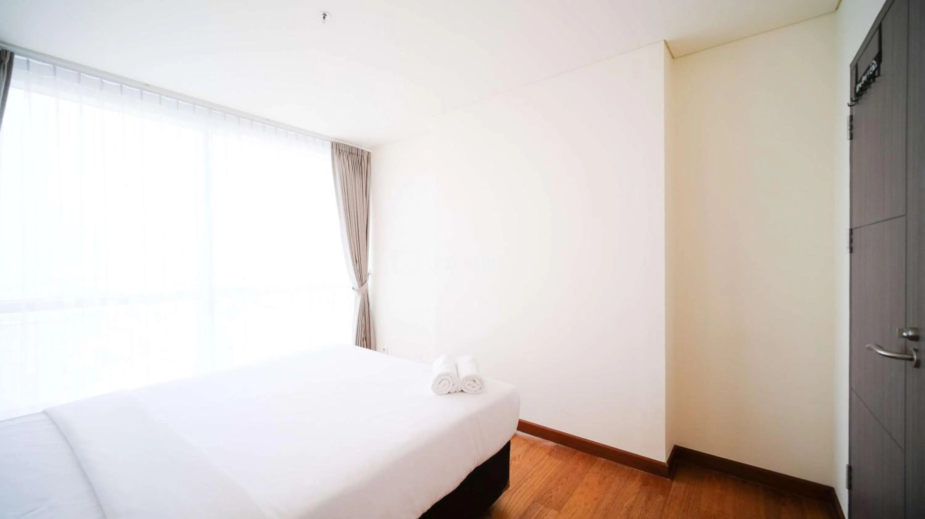 Bed in Best Location and Strategic 2BR at Praxis Apartment By Travelio