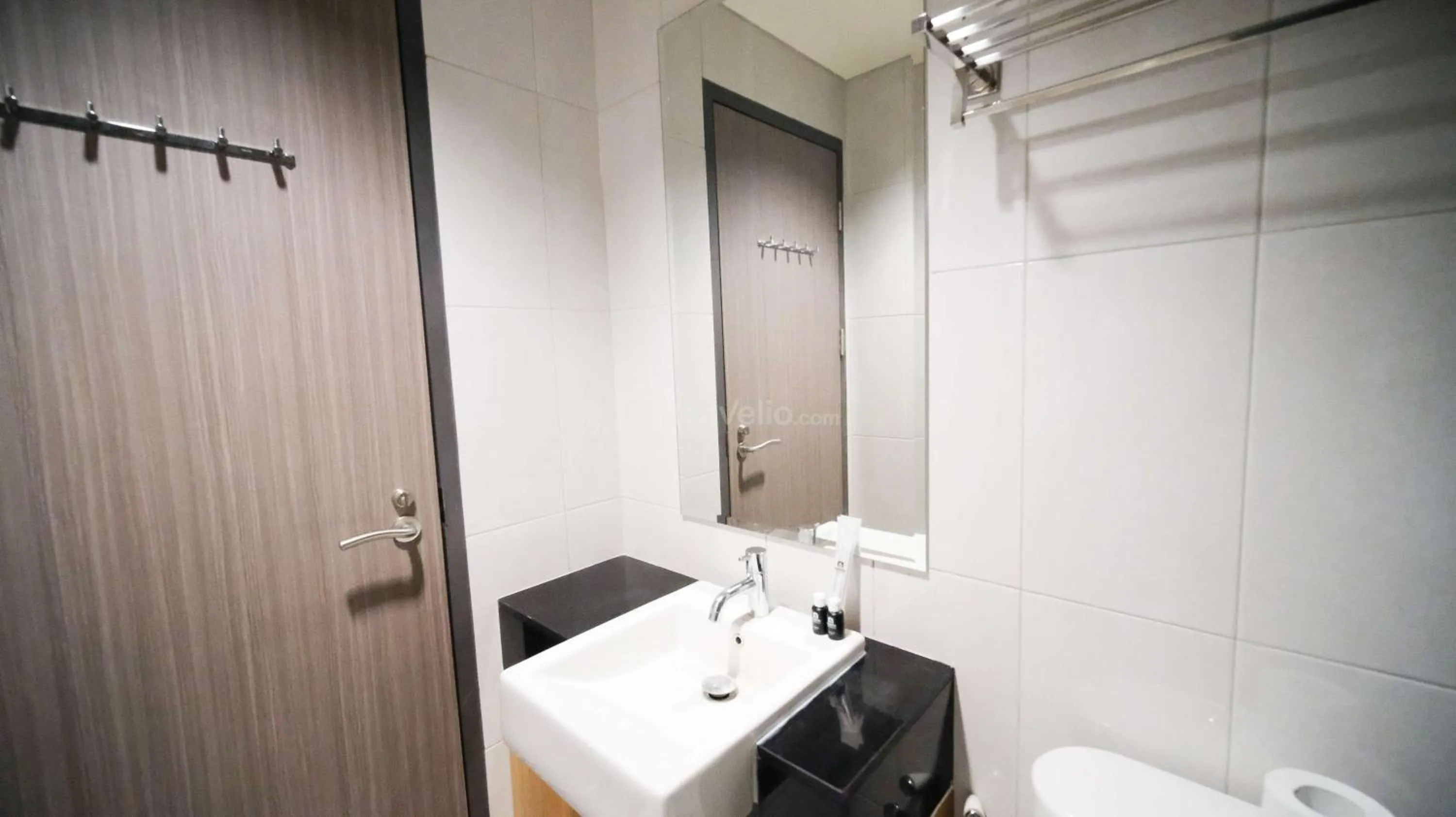 Bed in Best Location and Strategic 2BR at Praxis Apartment By Travelio
