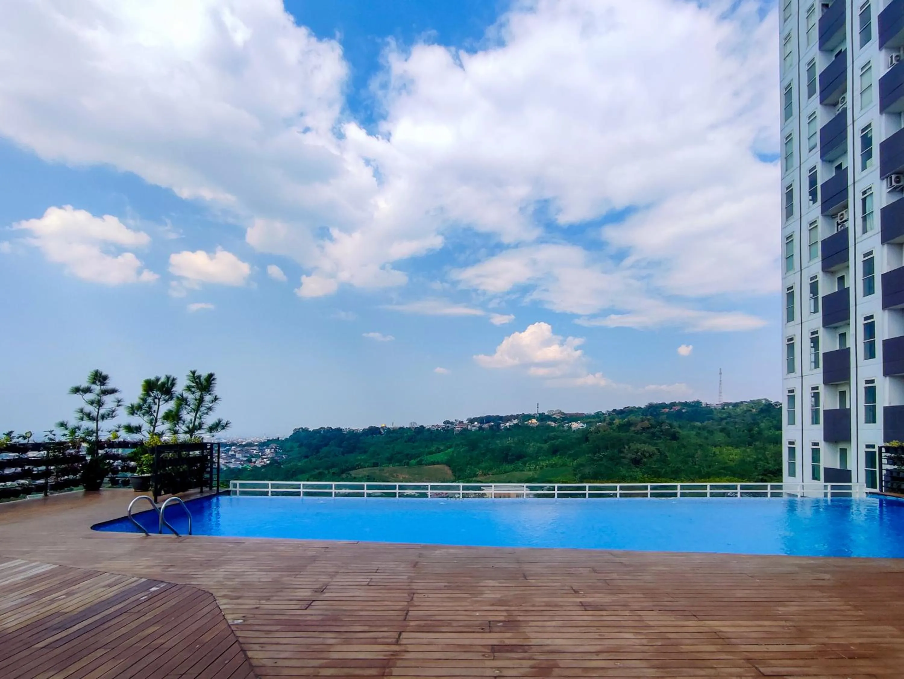 Property building in Fancy and Nice 1BR with Extra Room at Amartha View Apartment By Travelio