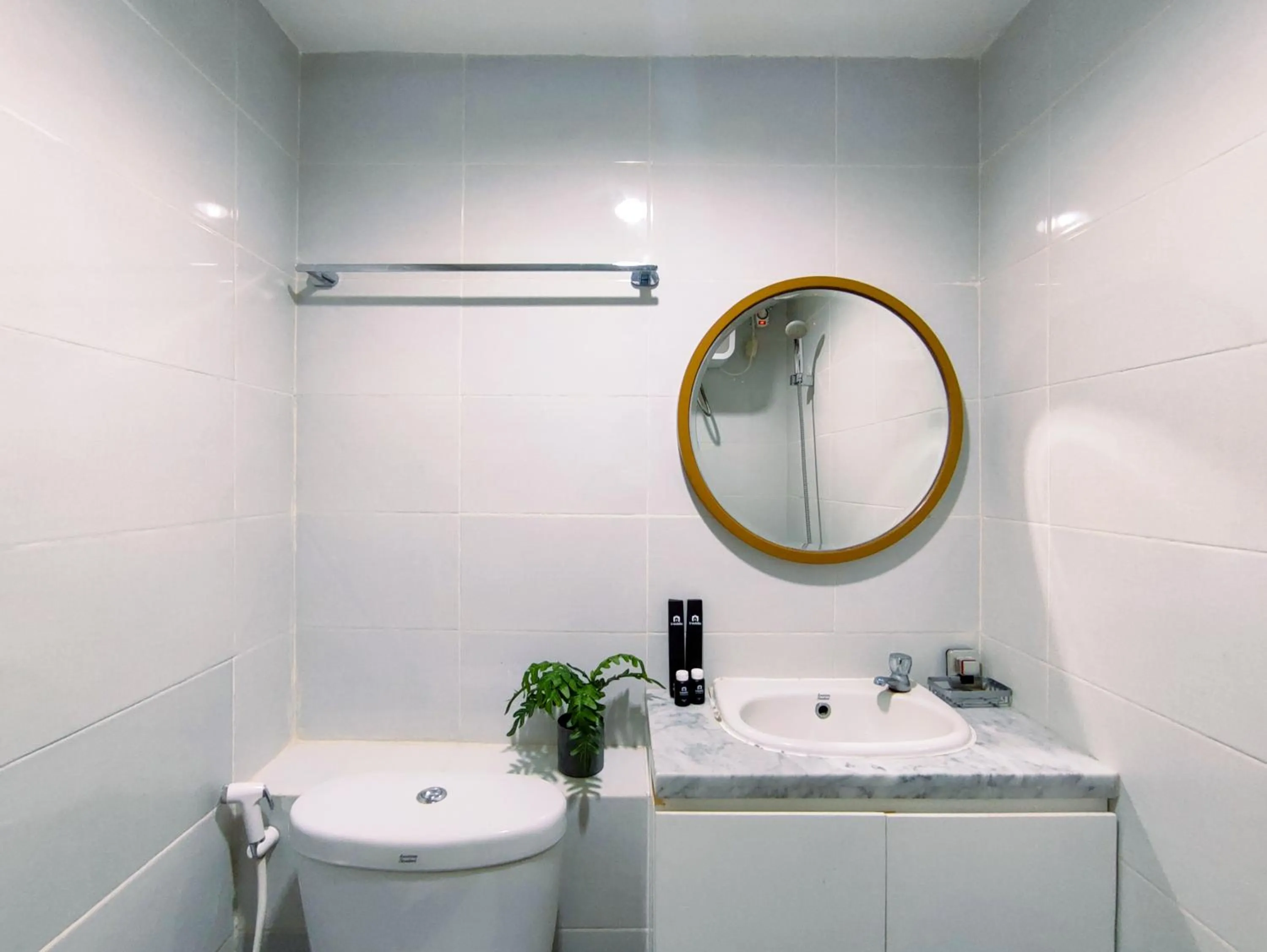 Bathroom in Fancy and Nice 1BR with Extra Room at Amartha View Apartment By Travelio
