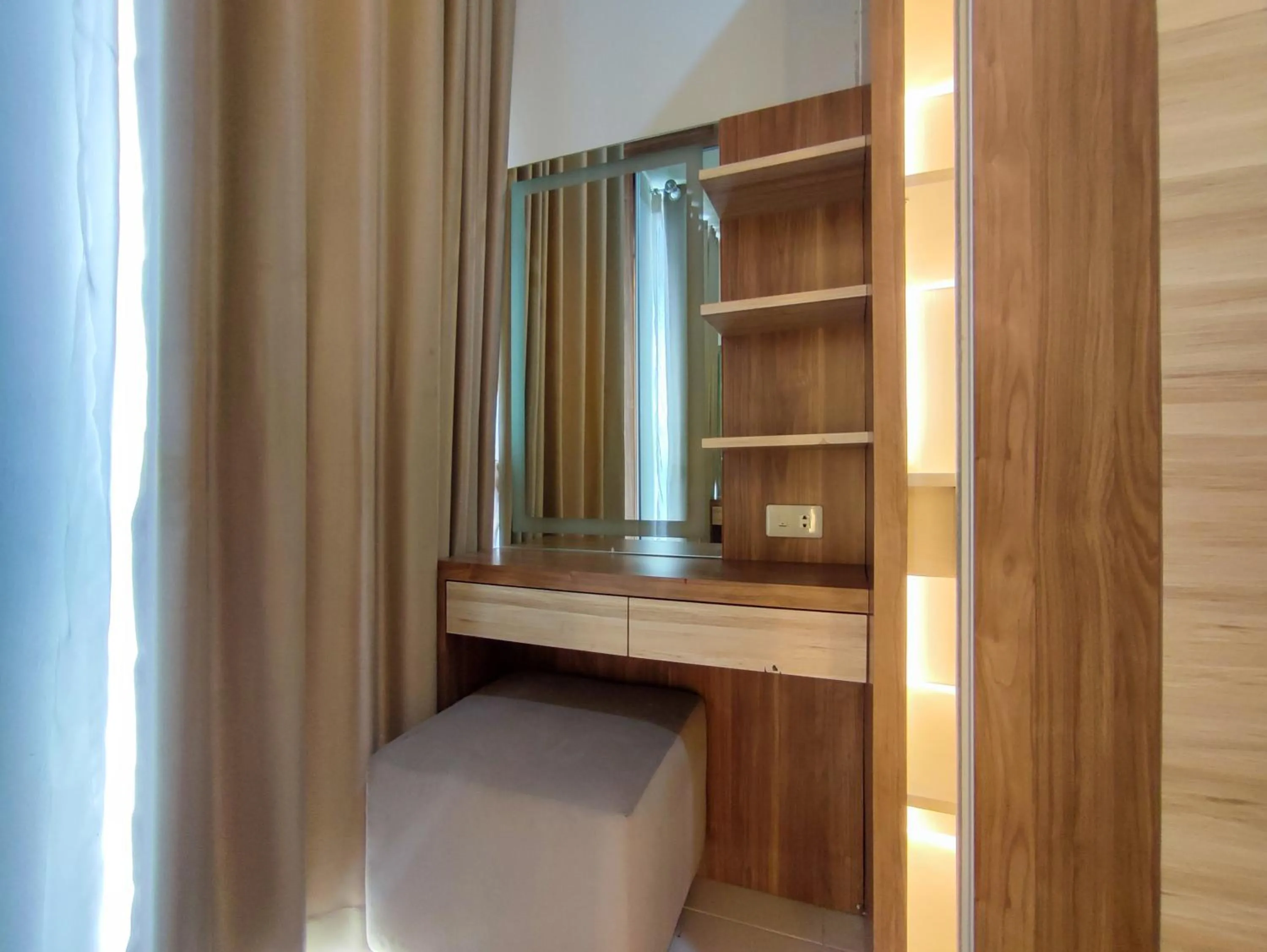Bedroom in Fancy and Nice 1BR with Extra Room at Amartha View Apartment By Travelio