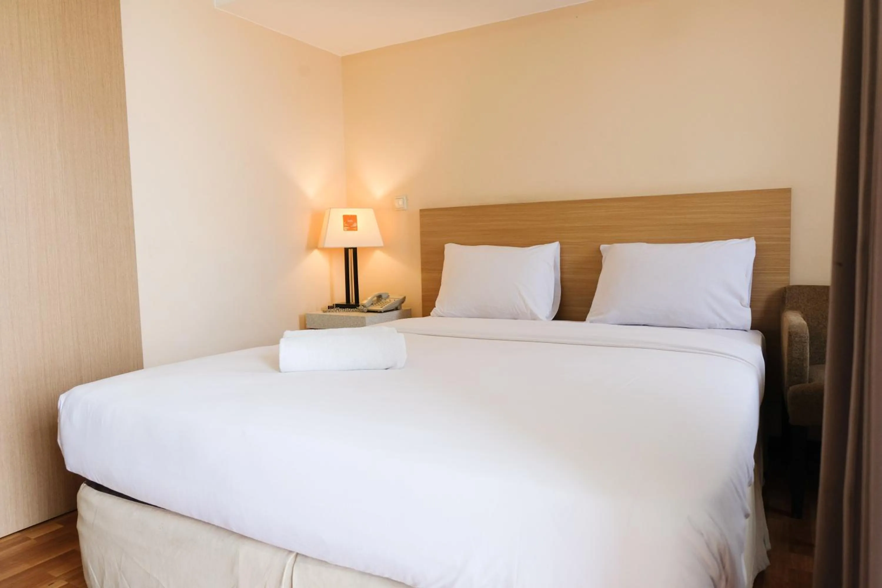Bed in Strategic and Comfy 1BR at Braga City Walk Apartment By Travelio