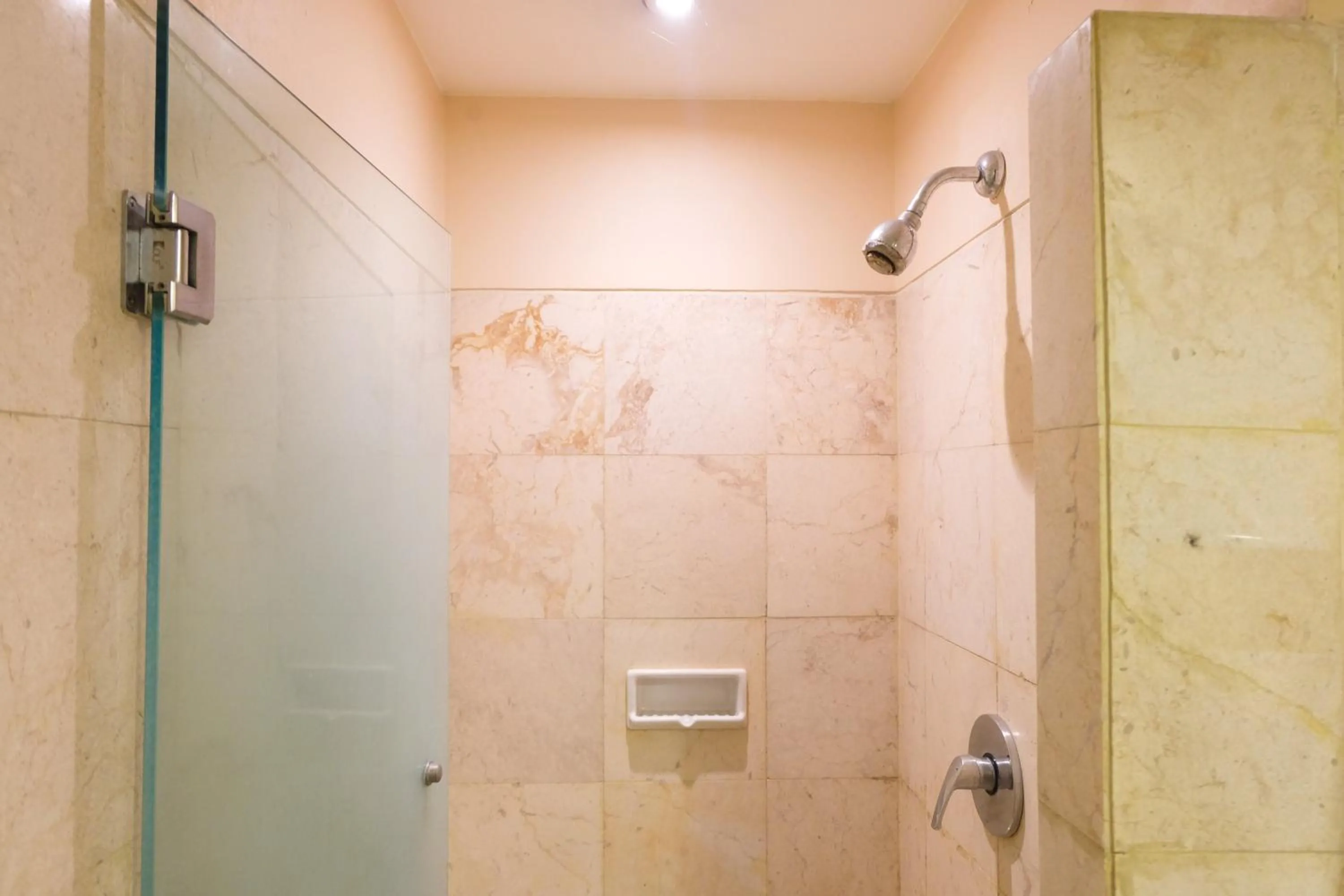 Bathroom in Strategic and Comfy 1BR at Braga City Walk Apartment By Travelio