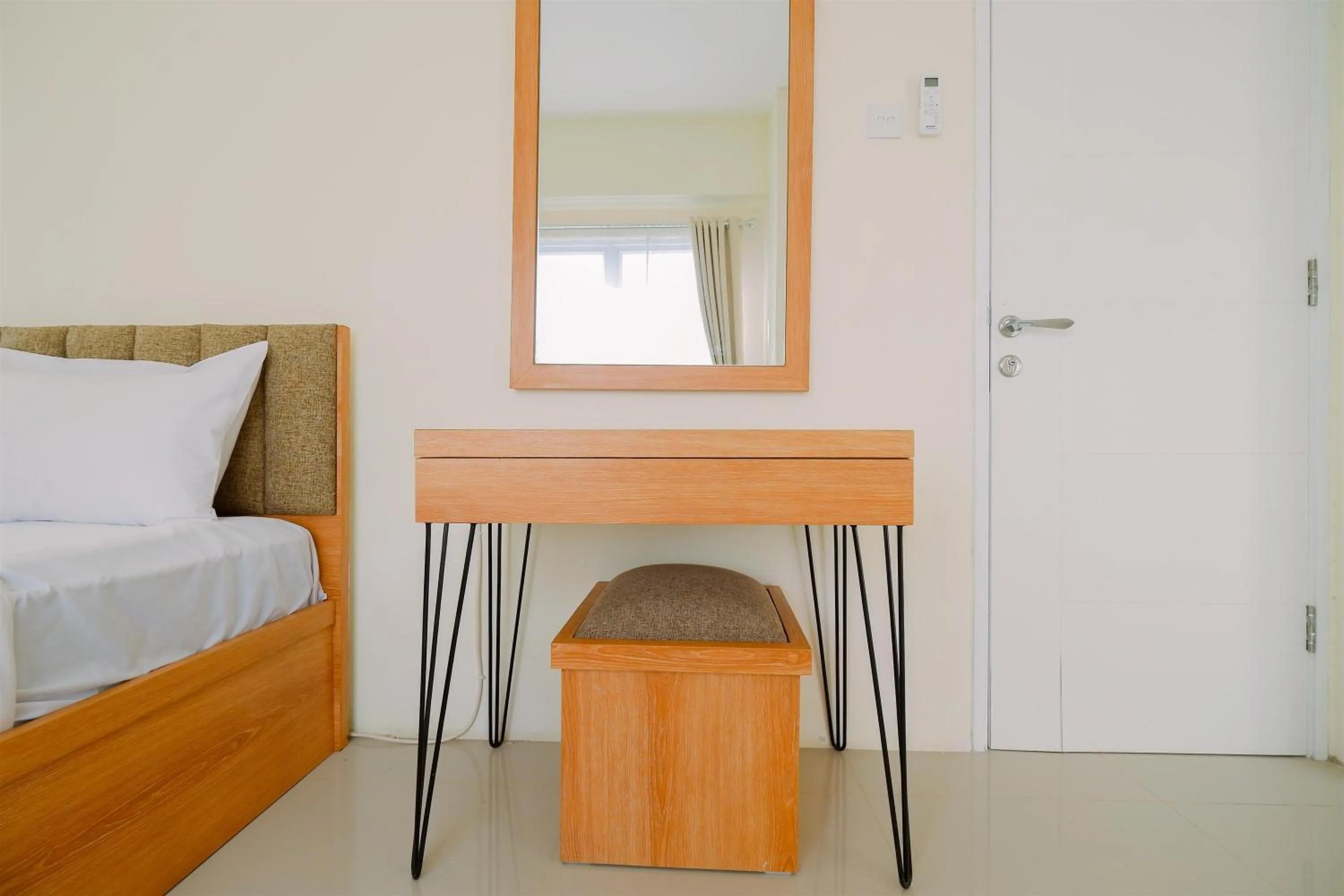 Bed in Warm and Cozy Living 2BR Bogorienze Apartment By Travelio