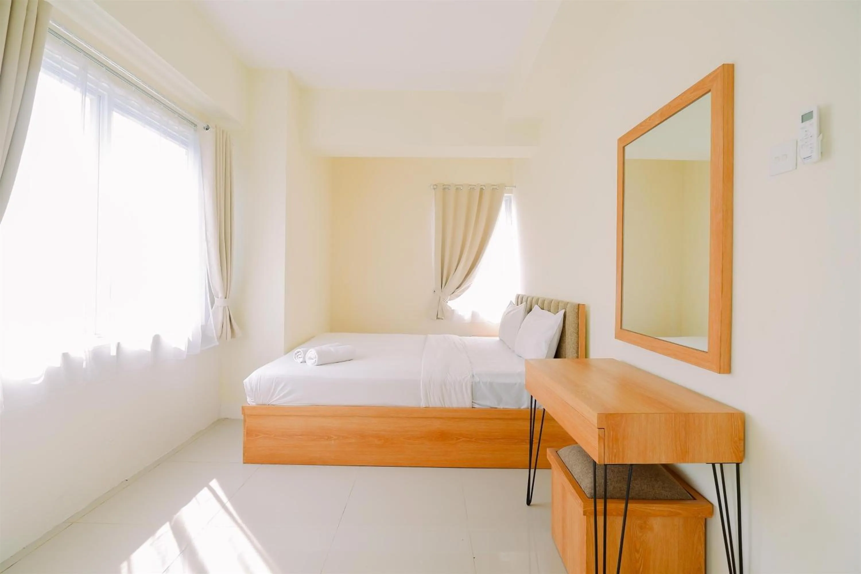 Bed in Warm and Cozy Living 2BR Bogorienze Apartment By Travelio