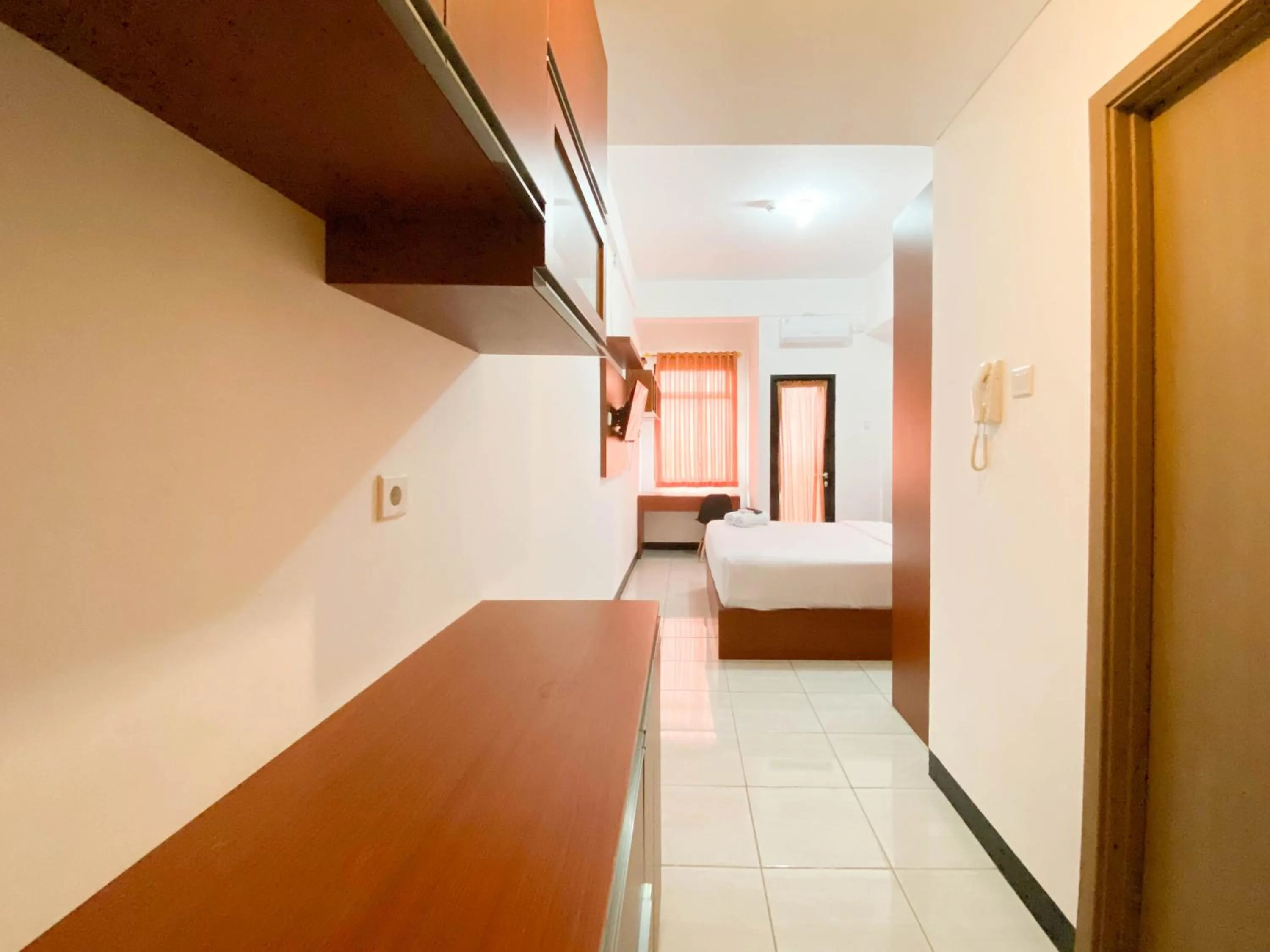 Bed in Cozy Stay Studio Cordova Edupartment Semarang Apartment By Travelio
