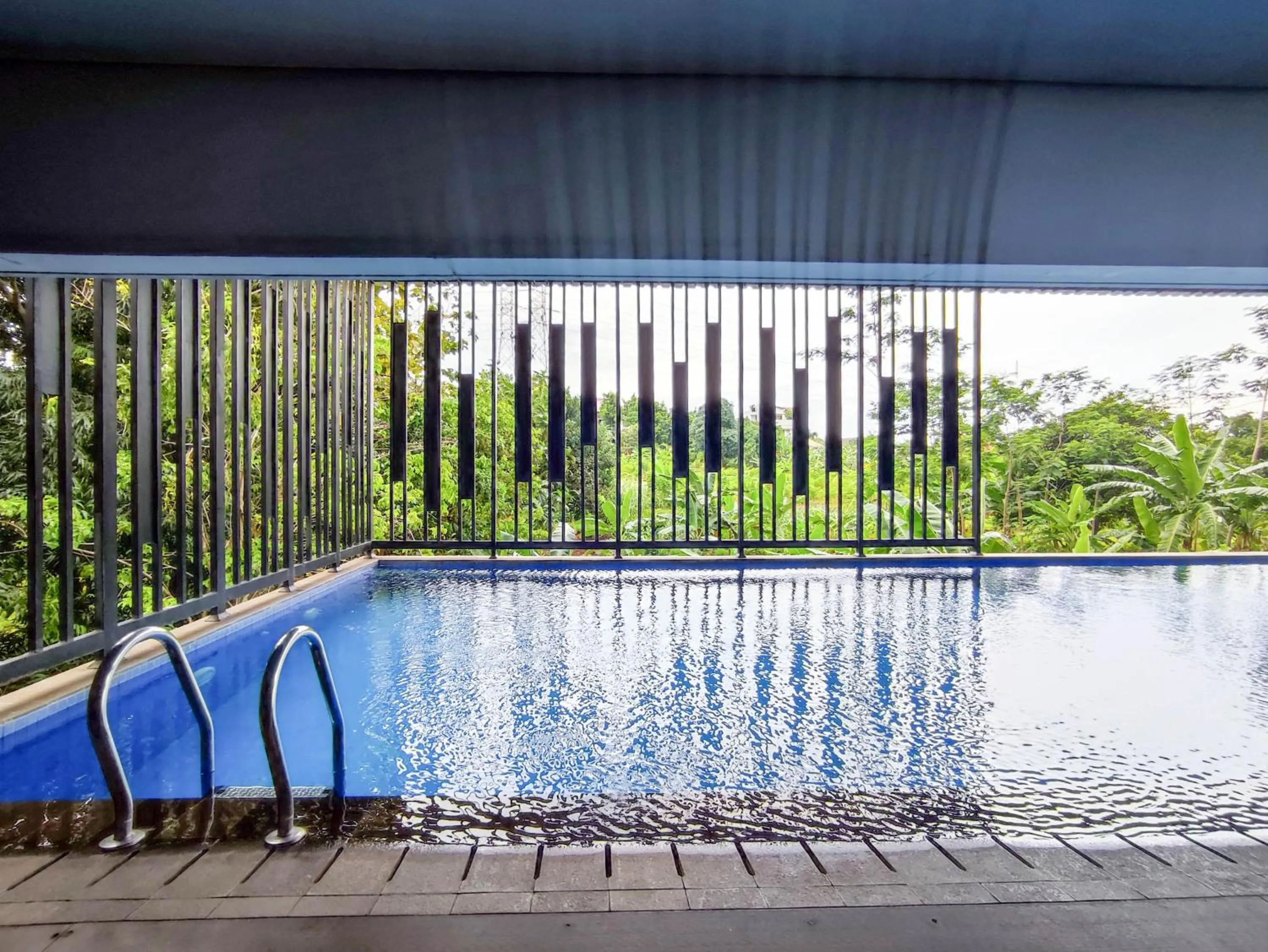 Swimming pool in Cozy Stay Studio Cordova Edupartment Semarang Apartment By Travelio