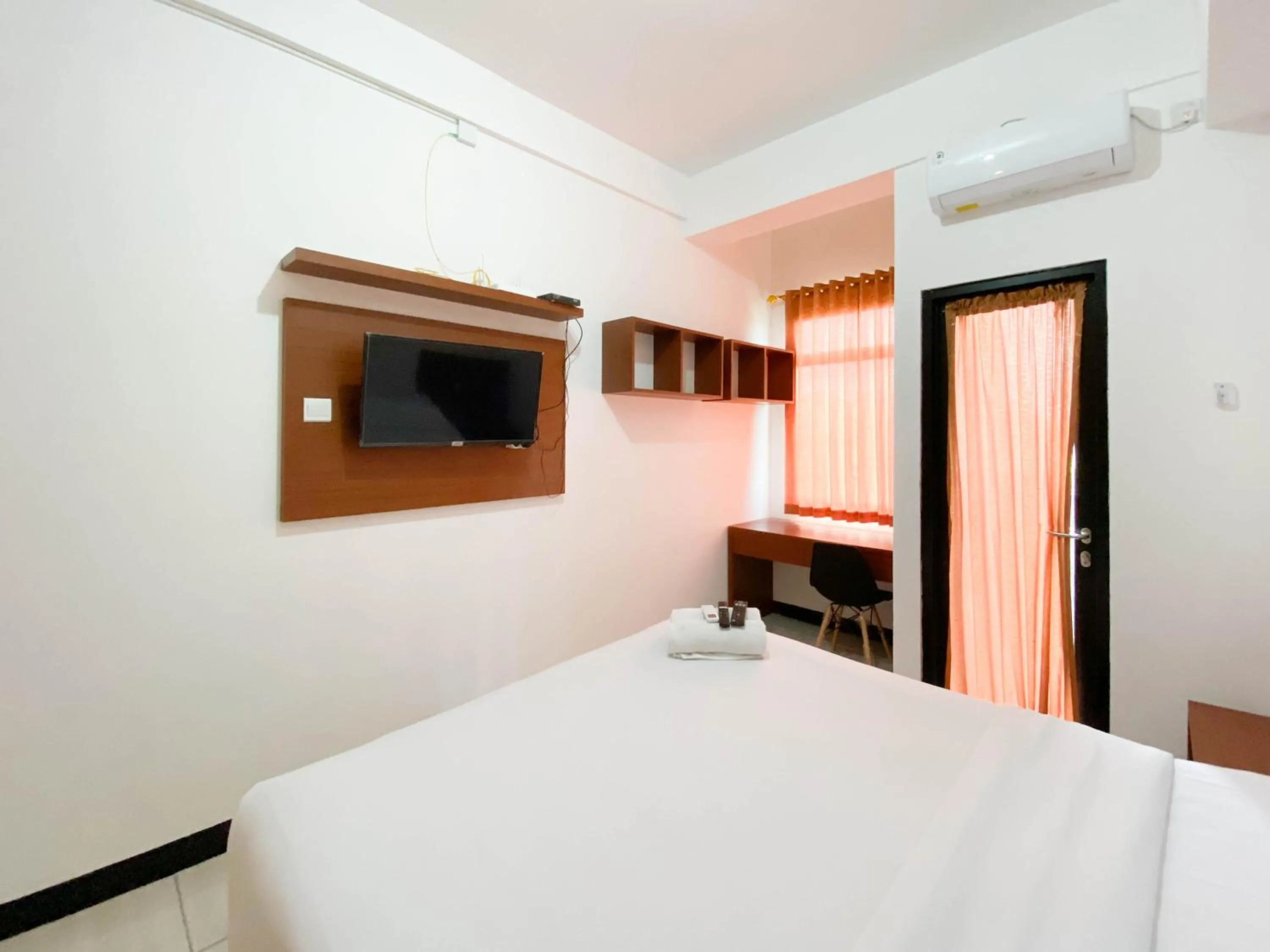 Bed in Cozy Stay Studio Cordova Edupartment Semarang Apartment By Travelio
