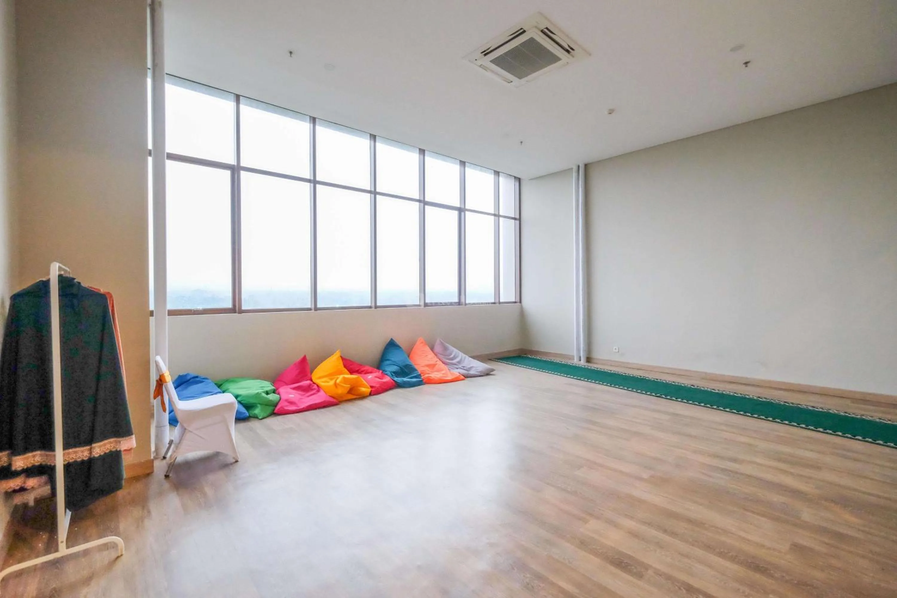Homey and Minimalist 1BR Royal Sentul Park Apartment By Travelio