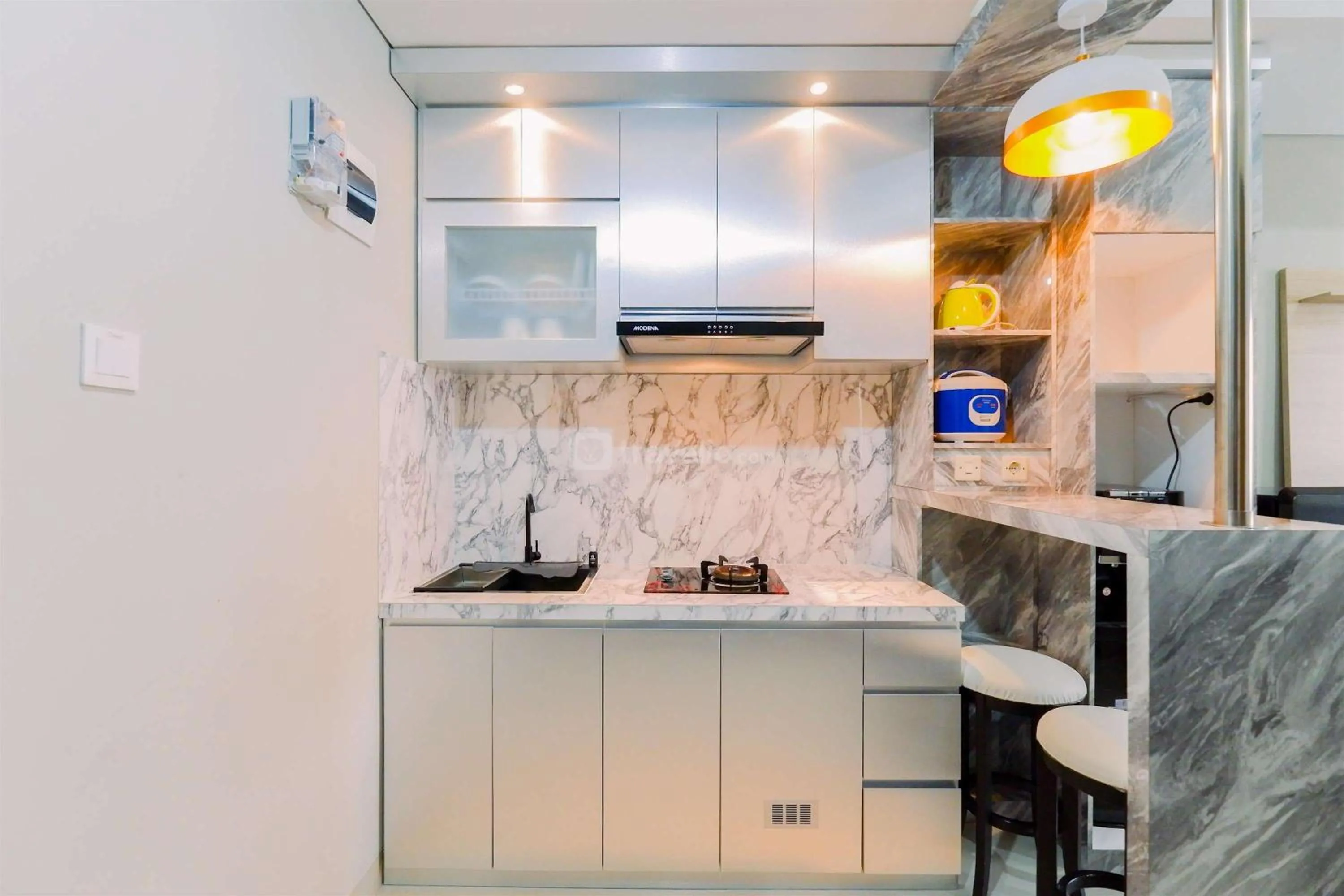 Homey and Minimalist 1BR Royal Sentul Park Apartment By Travelio