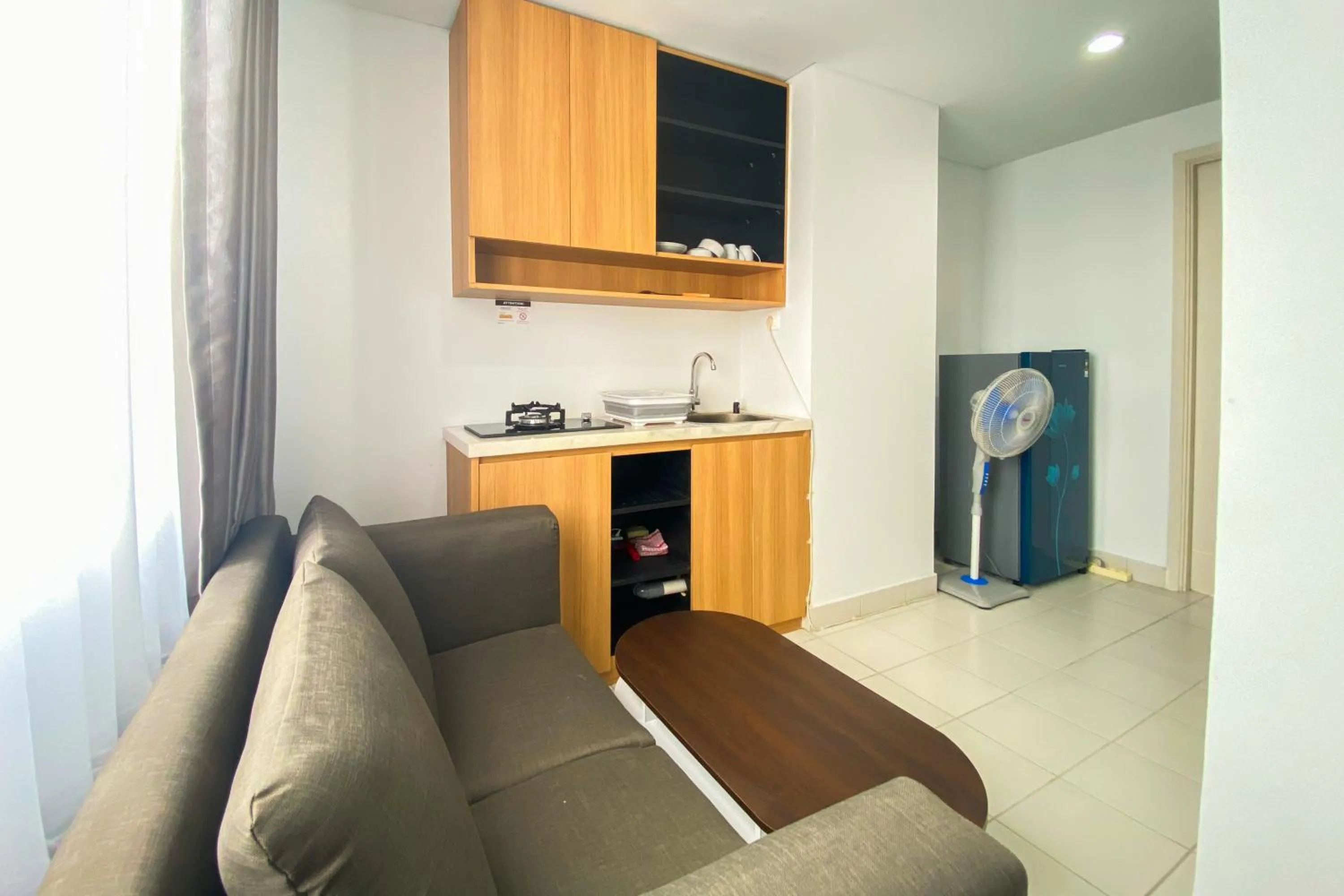 Comfort 1BR at Patraland Urbano Apartment By Travelio