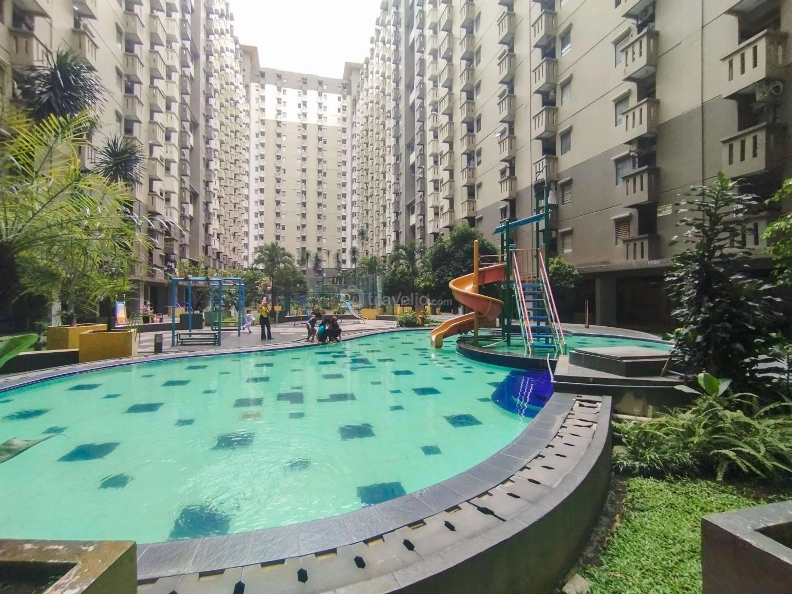 Bed in Serene 2BR Apartment at Gateway Ahmad Yani Cicadas By Travelio