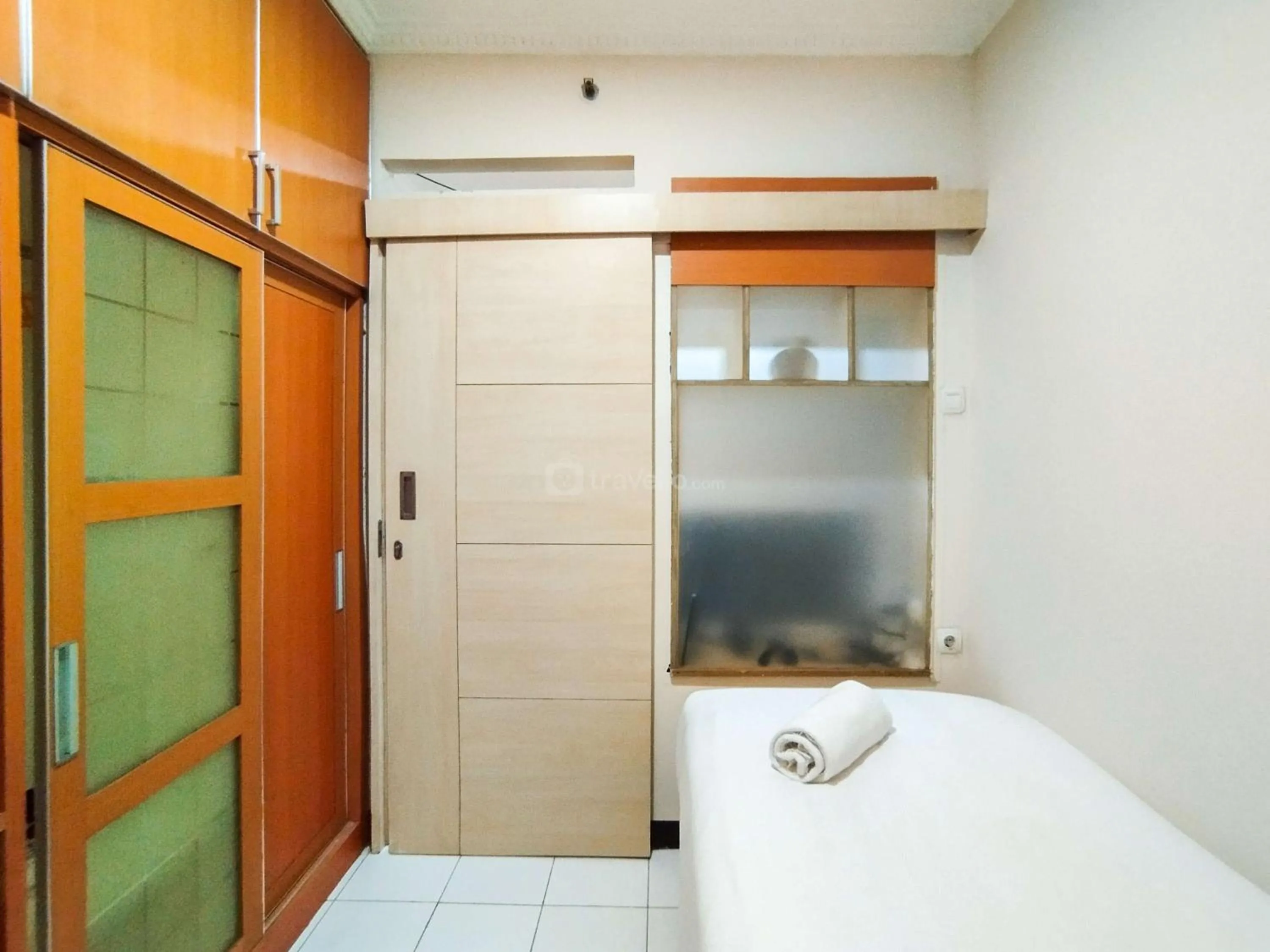 Bed in Serene 2BR Apartment at Gateway Ahmad Yani Cicadas By Travelio