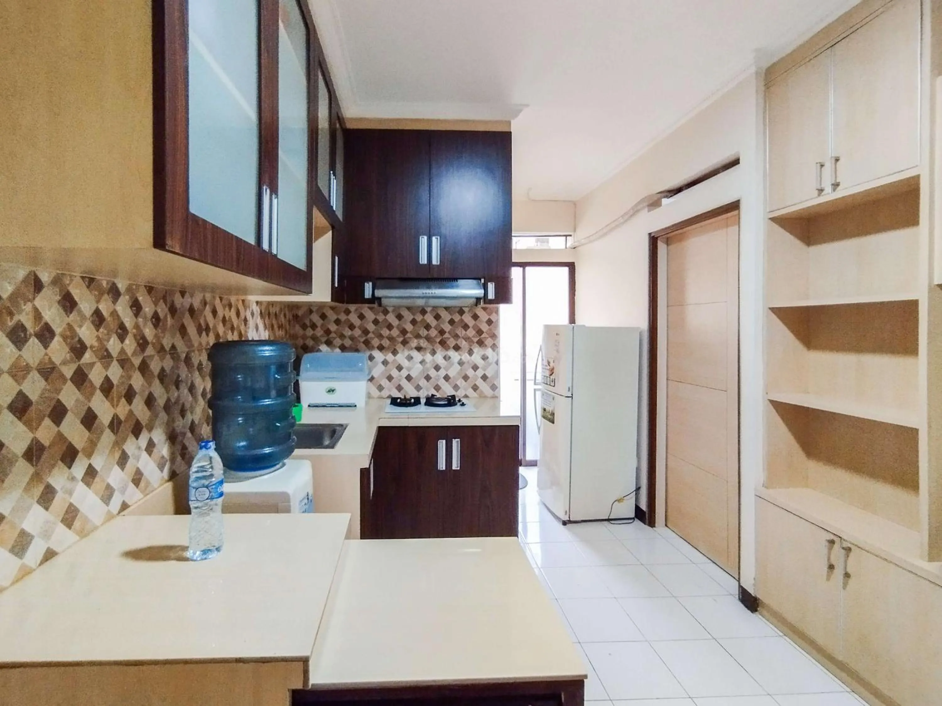 Bed in Serene 2BR Apartment at Gateway Ahmad Yani Cicadas By Travelio