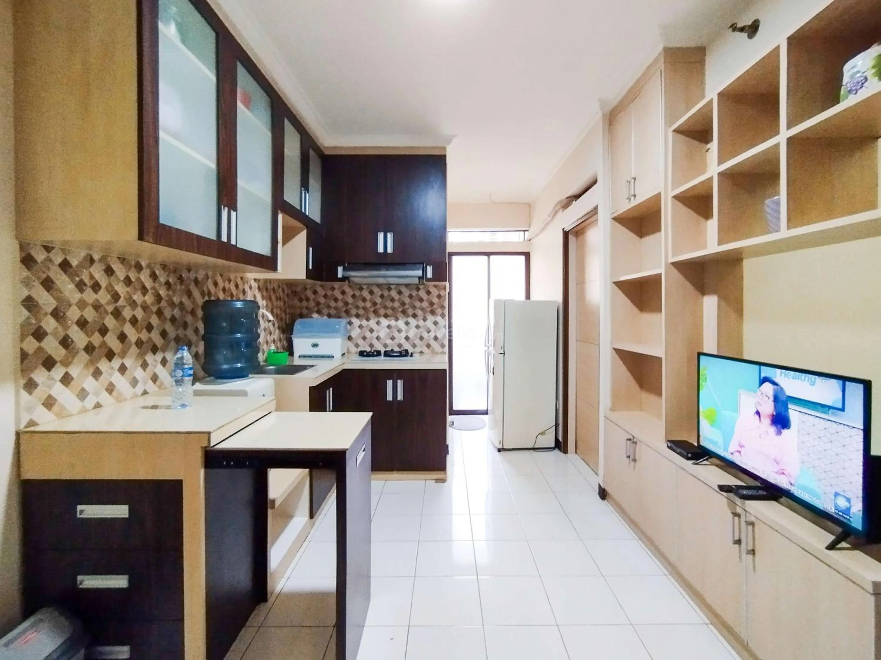 Bed in Serene 2BR Apartment at Gateway Ahmad Yani Cicadas By Travelio