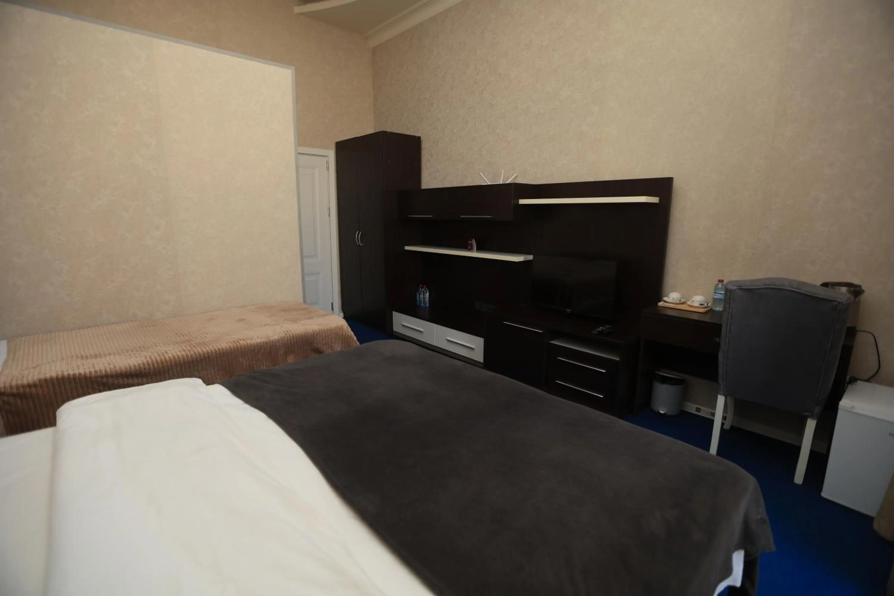 Bed in NH Nizami Hotel