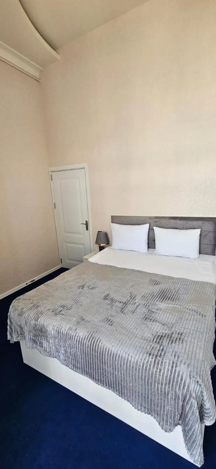 Bed in NH Nizami Hotel