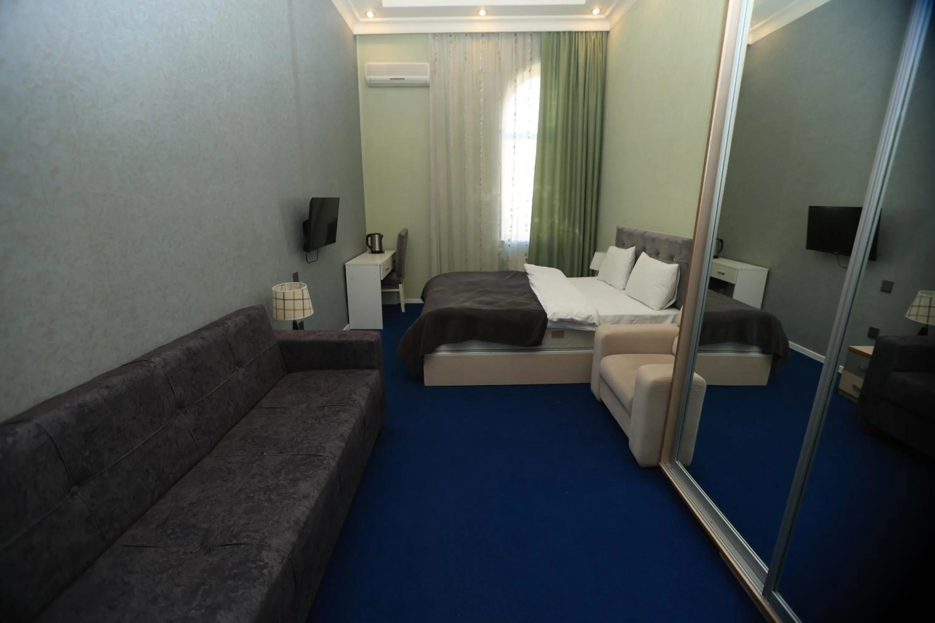 Bed in NH Nizami Hotel