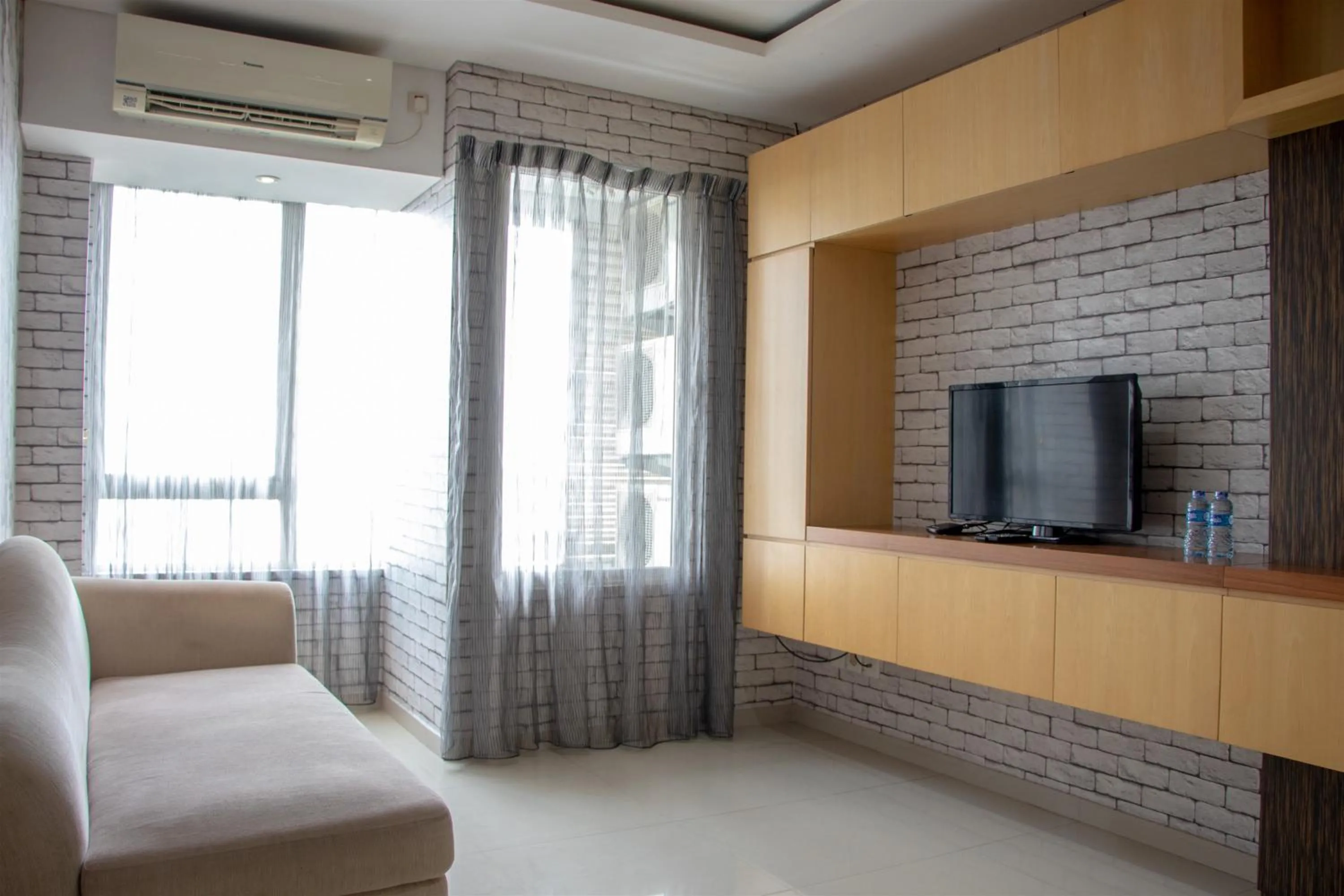 Comfort 2BR at Nifarro Park Apartment By Travelio