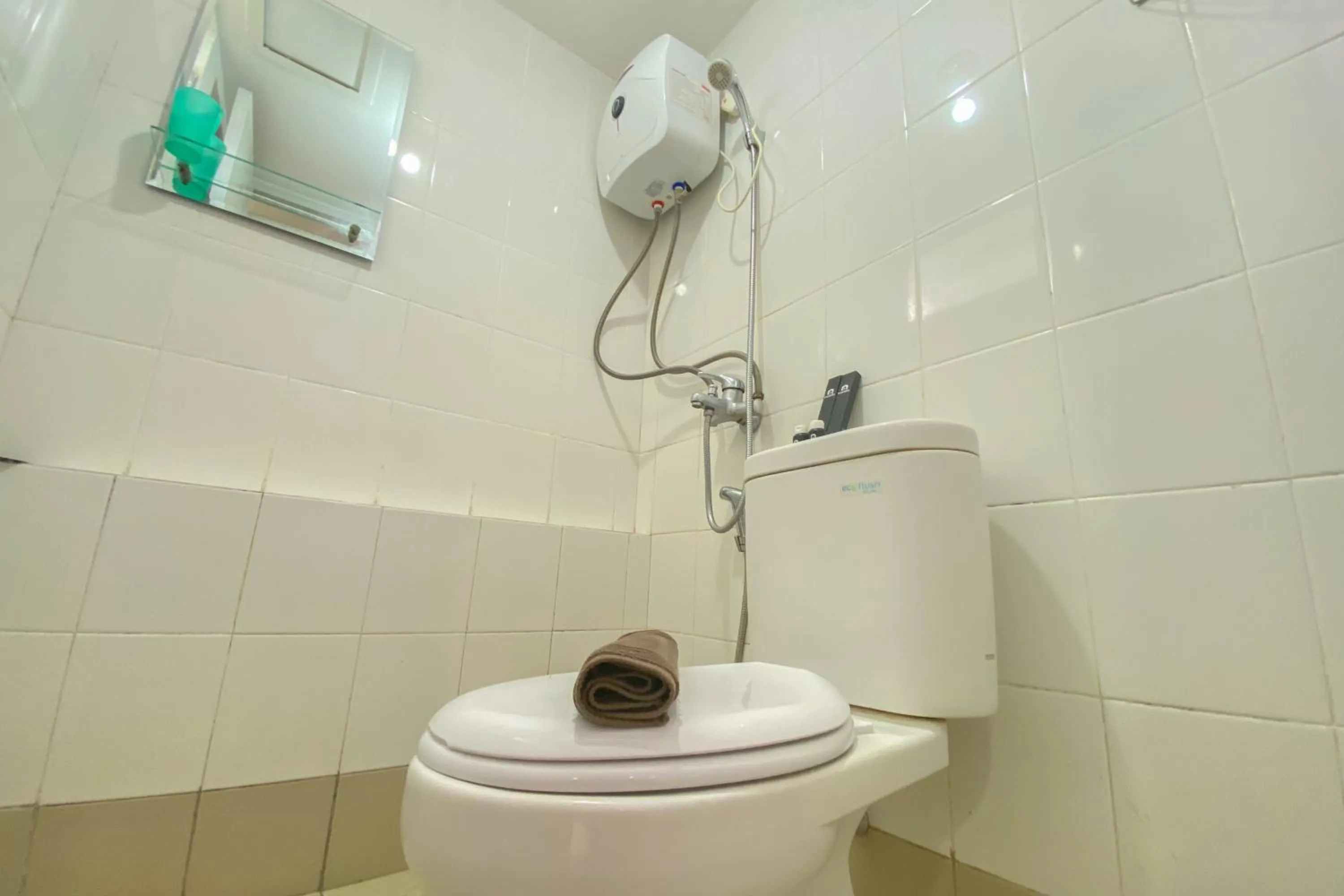 Bathroom in Best Deal and Spacious Studio at Bassura City Apartment By Travelio