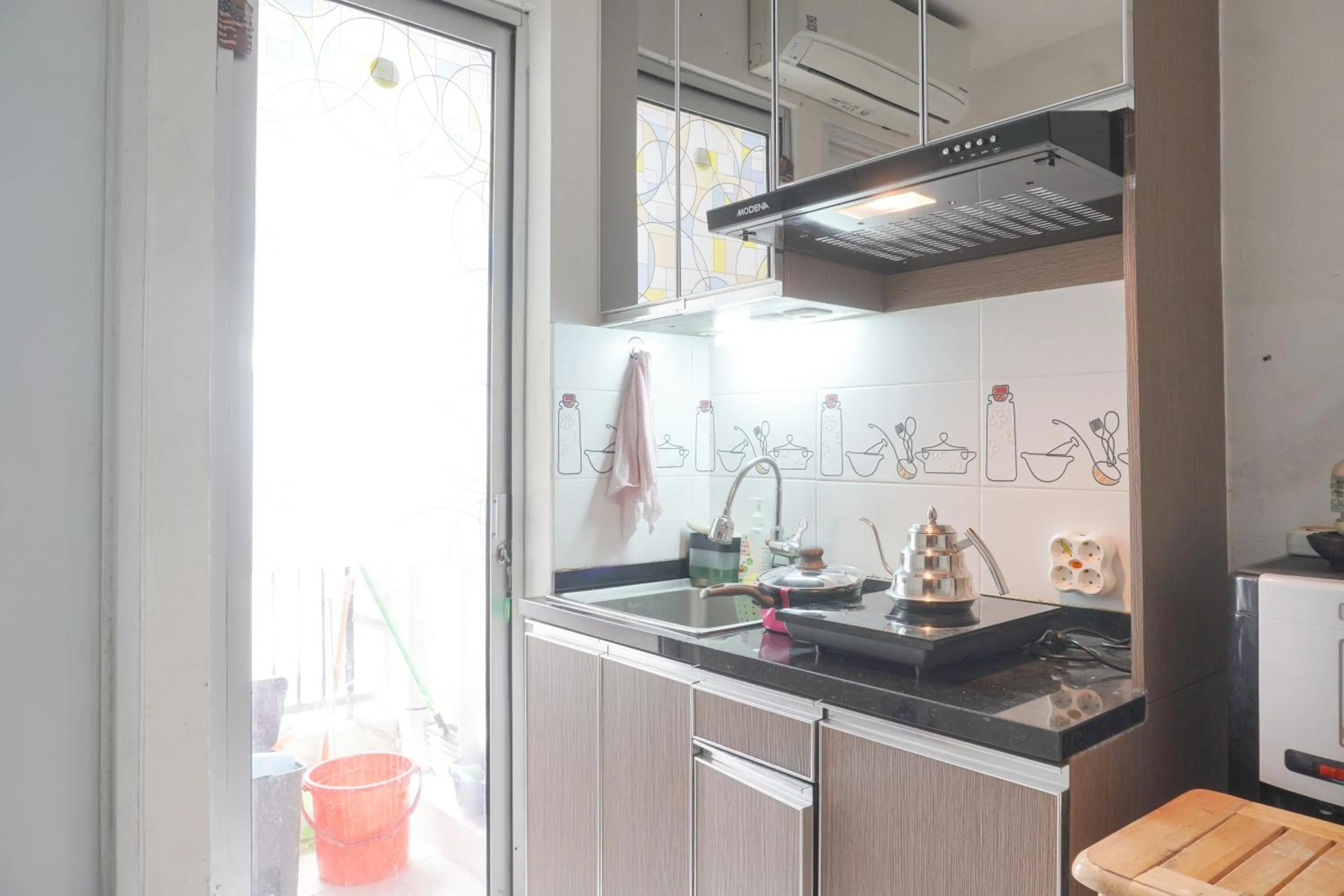 Kitchen or kitchenette in Best Startegic 2BR at Bassura Apartment By Travelio