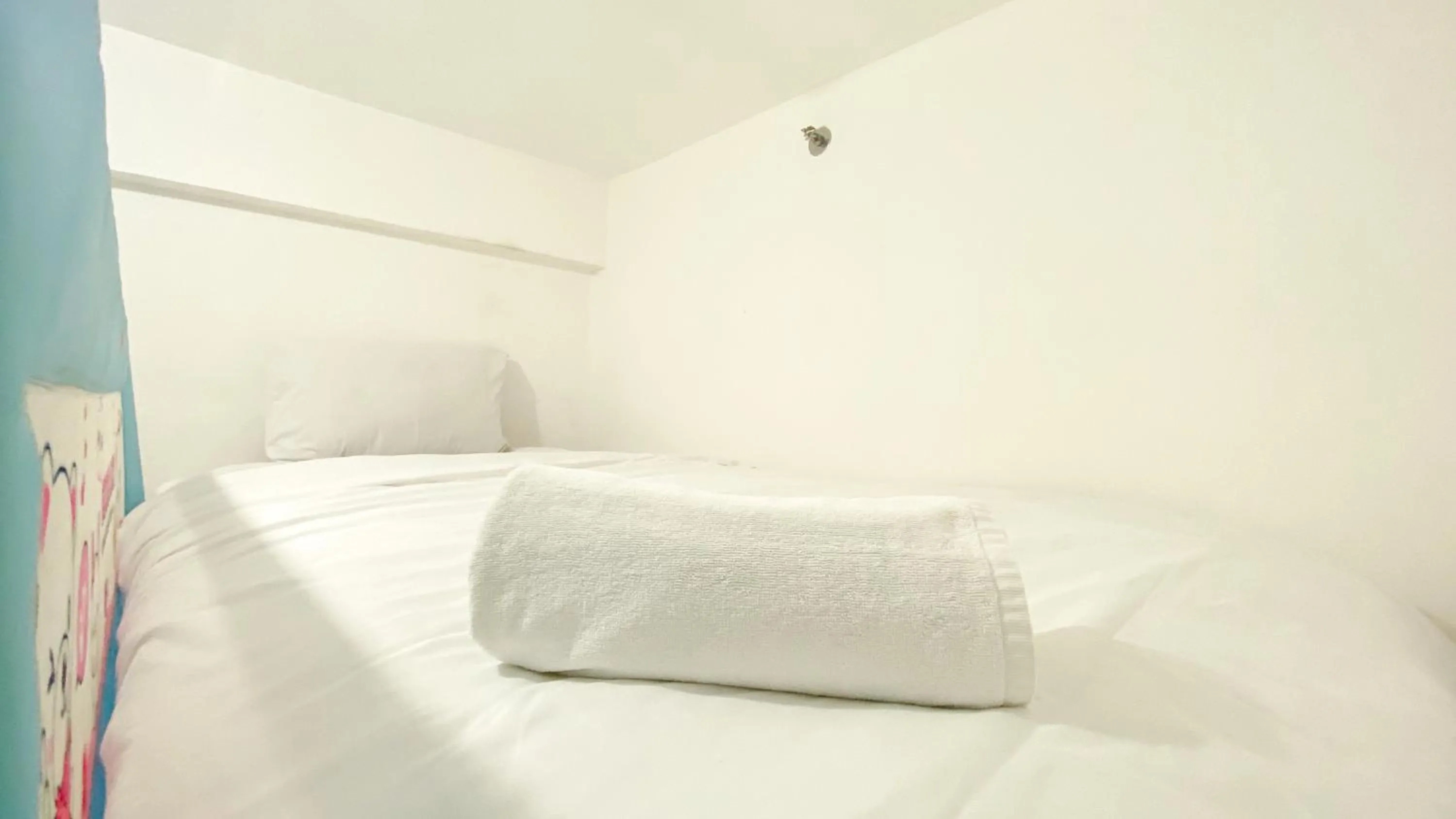 Bed in Best Startegic 2BR at Bassura Apartment By Travelio