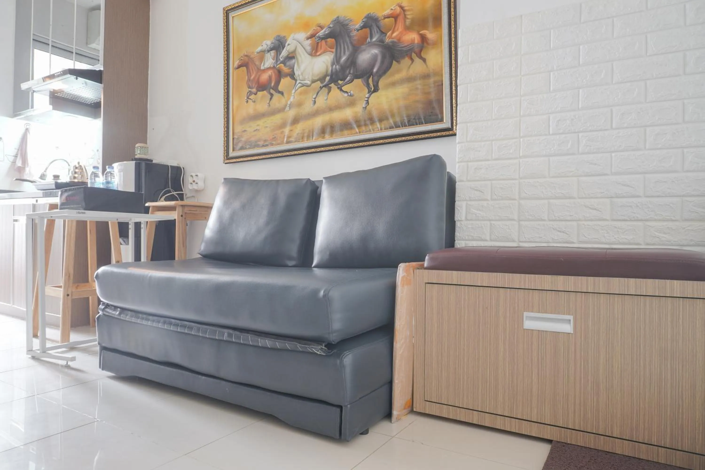 Living room in Best Startegic 2BR at Bassura Apartment By Travelio