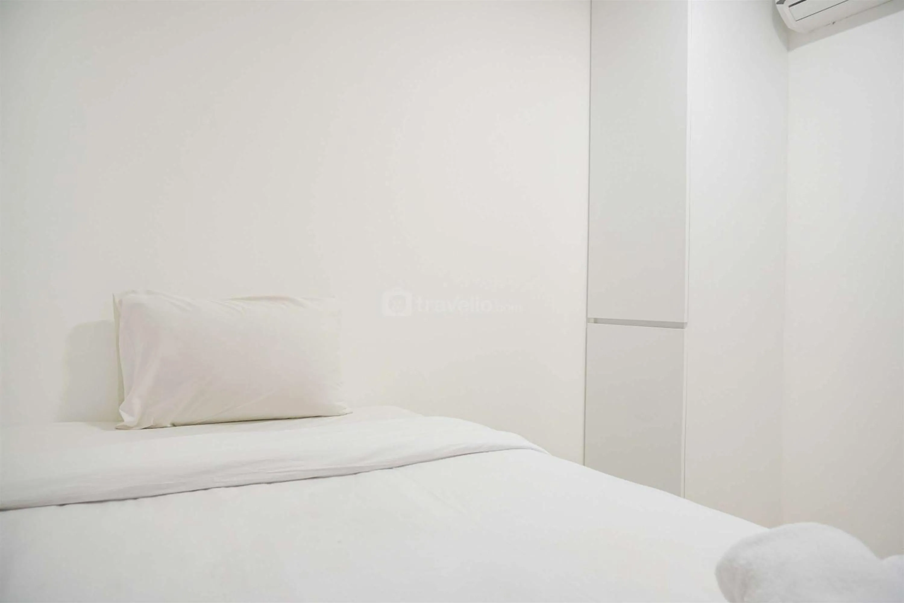 Bed in Modern and Homey 2BR at MT Haryono Square Apartment By Travelio