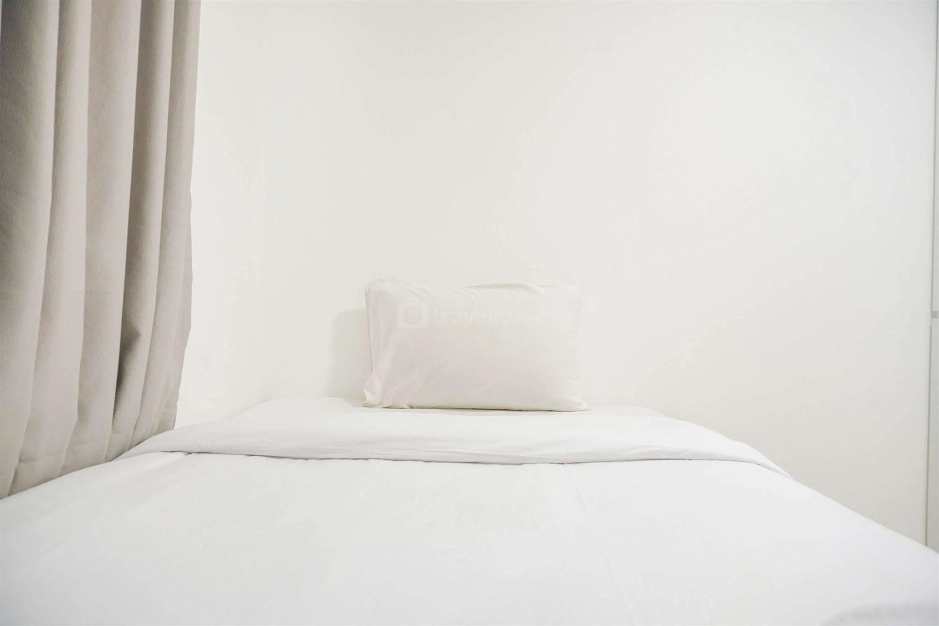 Bed in Modern and Homey 2BR at MT Haryono Square Apartment By Travelio