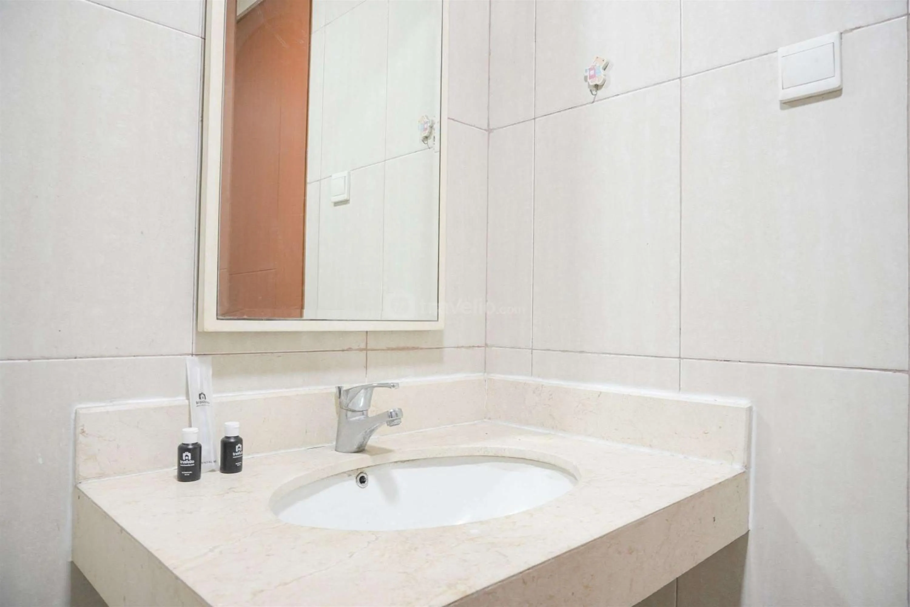 Bed in Modern and Homey 2BR at MT Haryono Square Apartment By Travelio