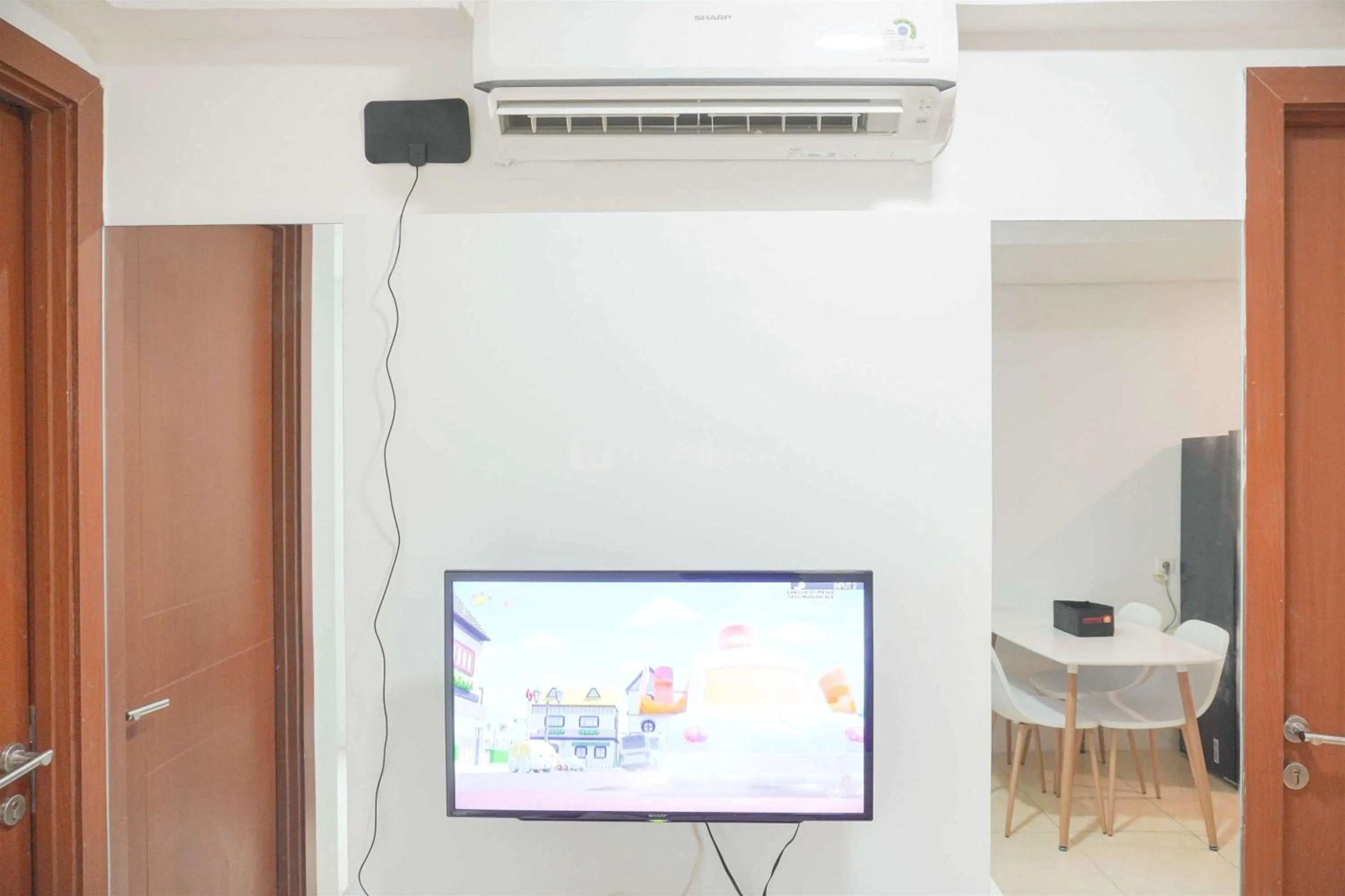 Bed in Modern and Homey 2BR at MT Haryono Square Apartment By Travelio