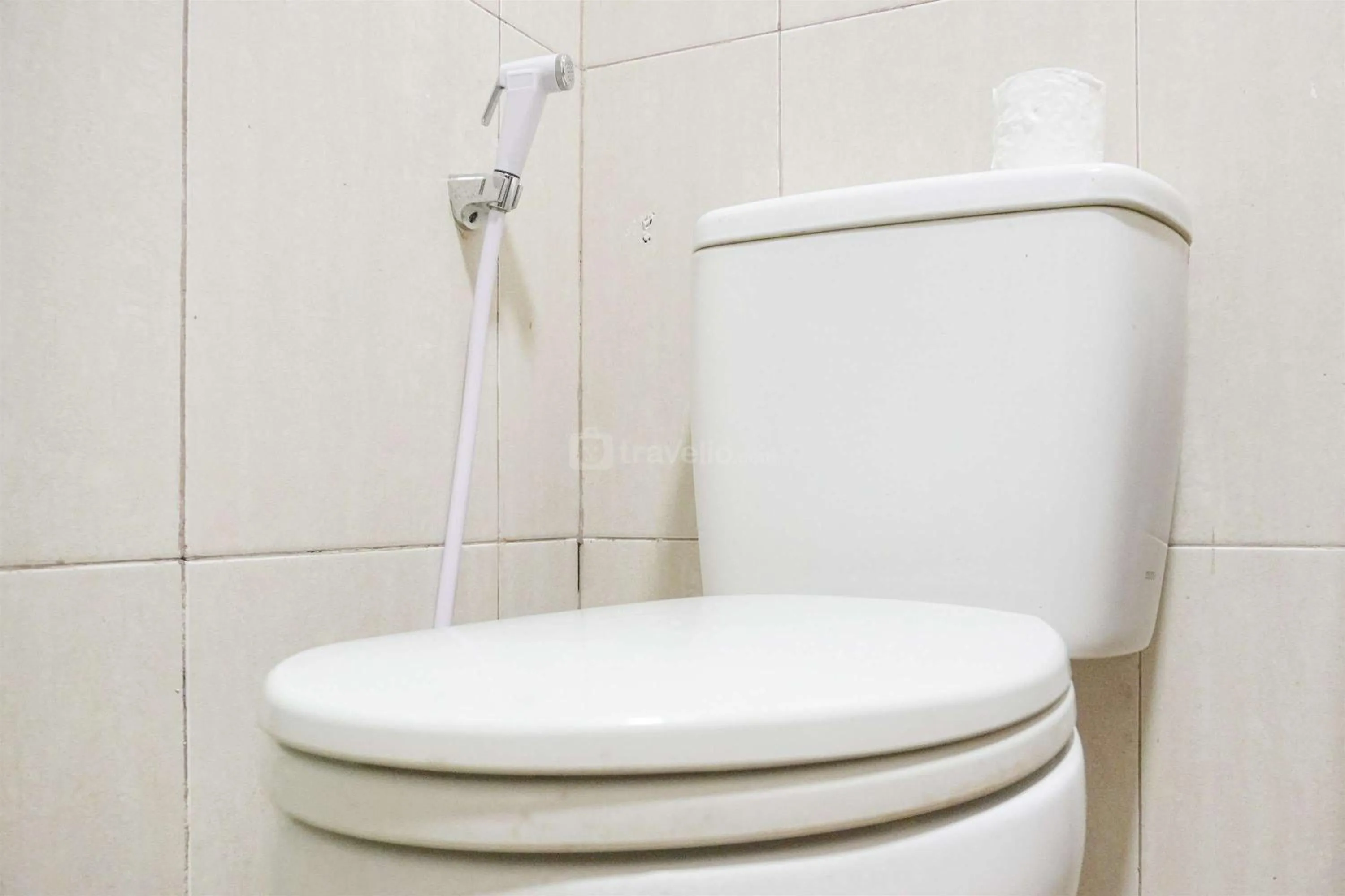 Bathroom in Modern and Homey 2BR at MT Haryono Square Apartment By Travelio