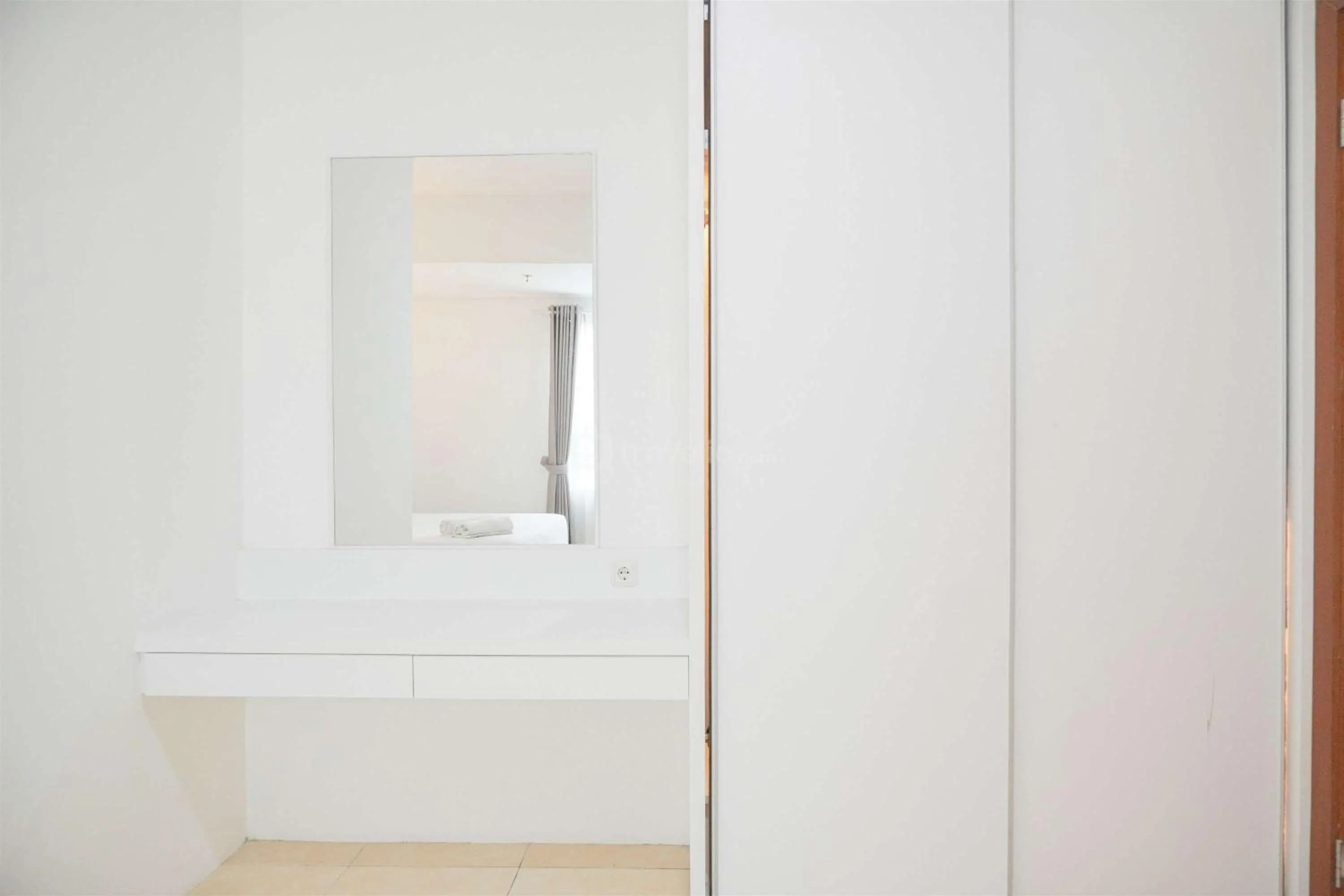 Bed in Modern and Homey 2BR at MT Haryono Square Apartment By Travelio