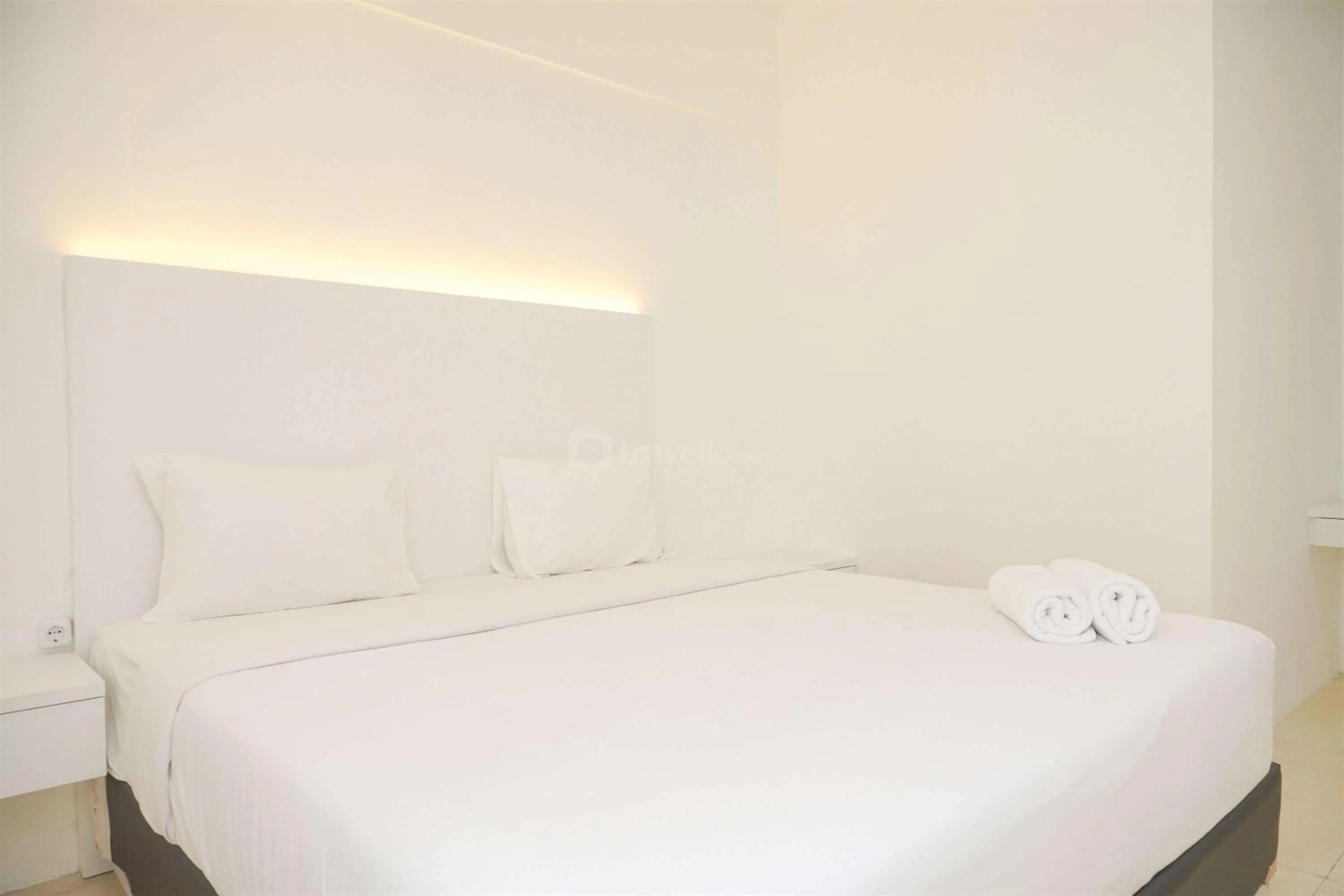Bed in Modern and Homey 2BR at MT Haryono Square Apartment By Travelio