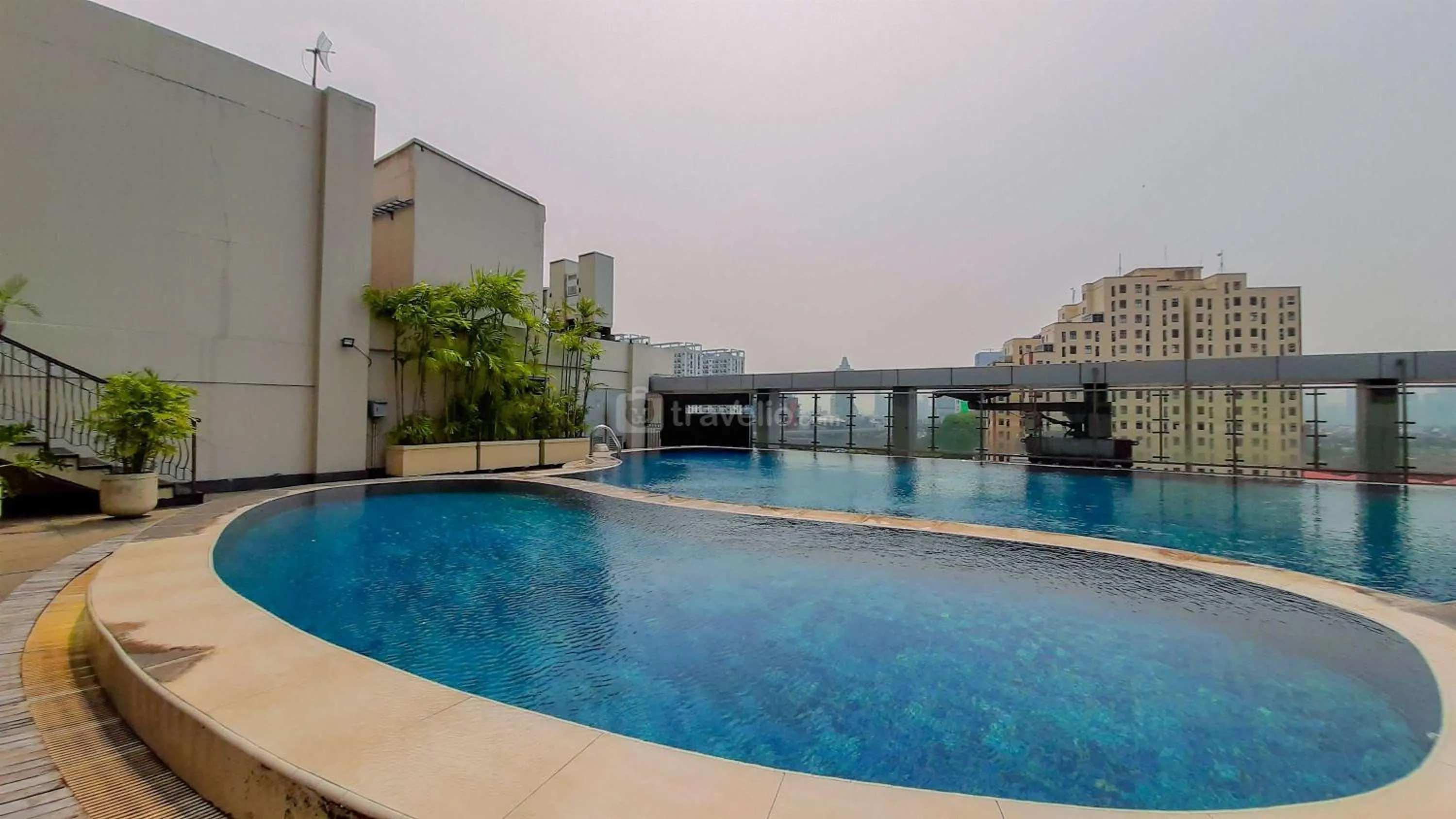 Swimming pool in Modern and Homey 2BR at MT Haryono Square Apartment By Travelio