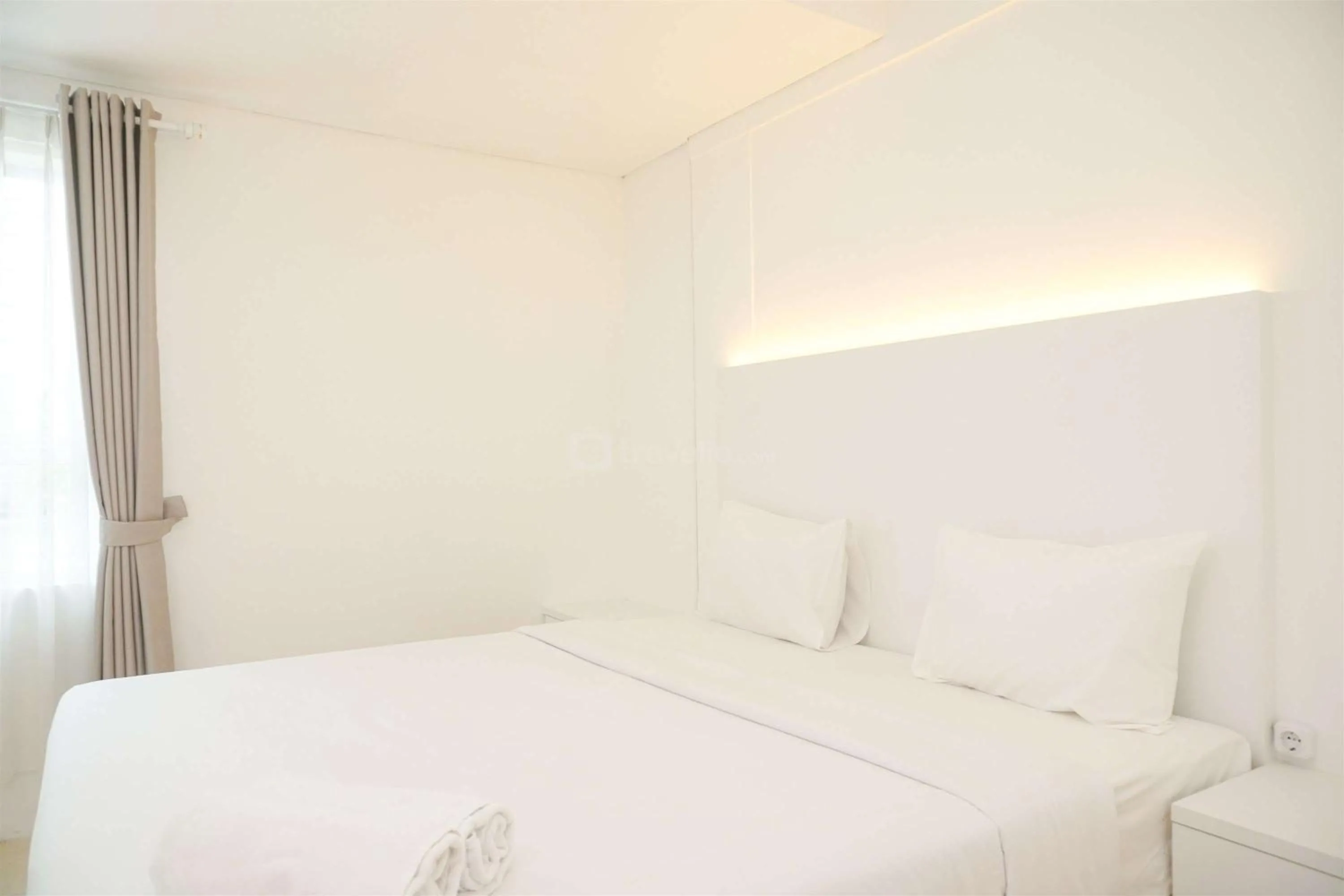 Bed in Modern and Homey 2BR at MT Haryono Square Apartment By Travelio