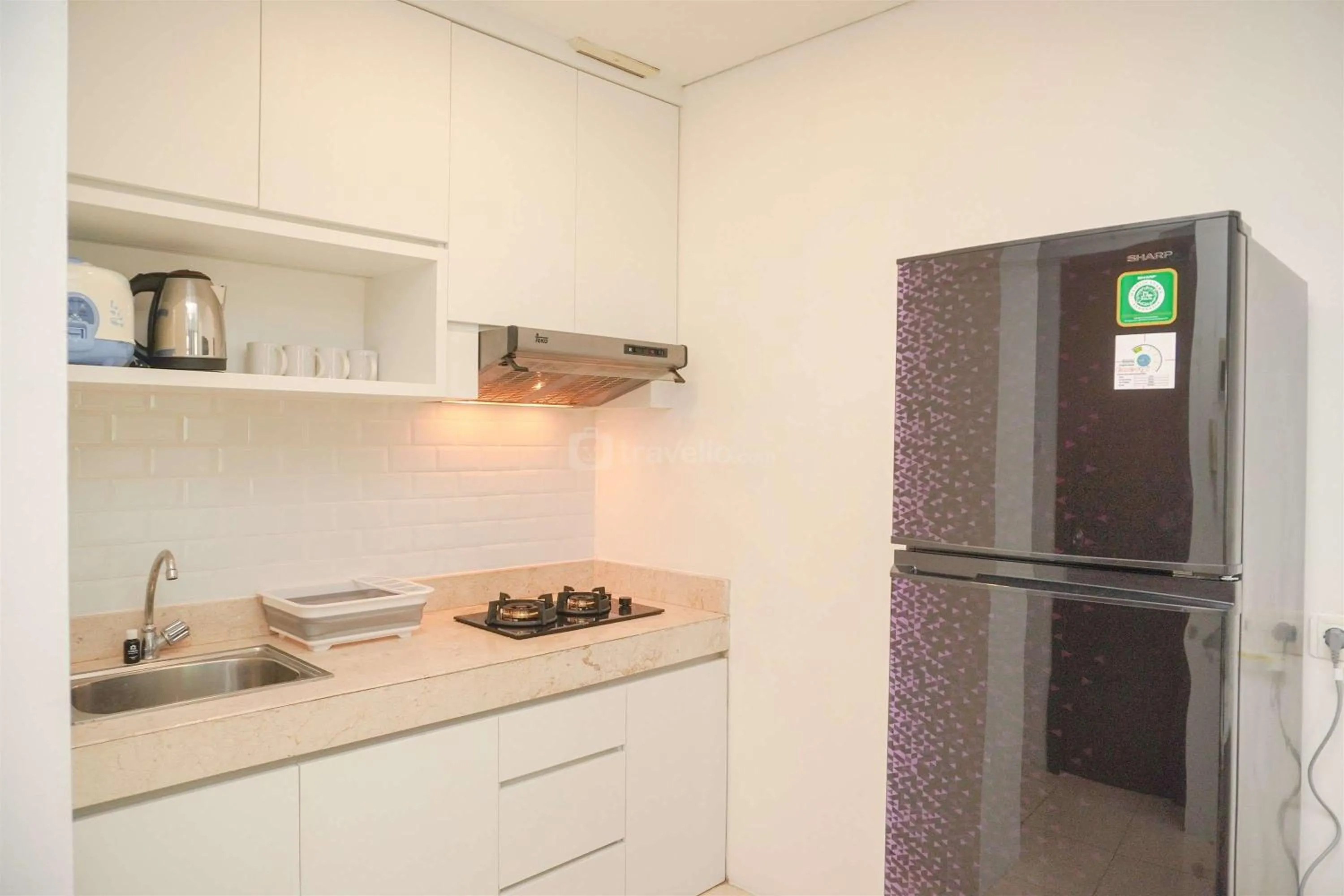 Bed in Modern and Homey 2BR at MT Haryono Square Apartment By Travelio