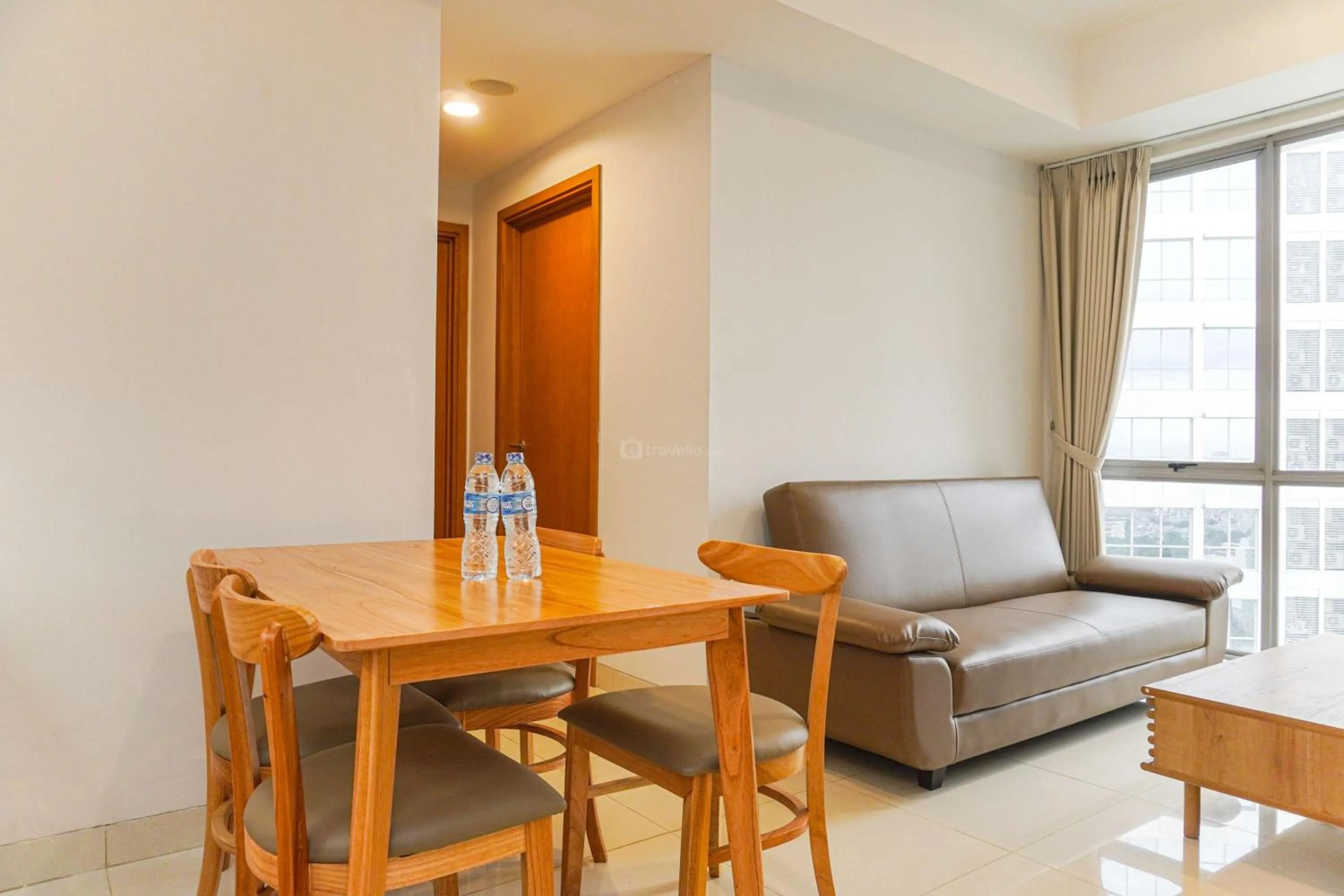 Bed in Minimalist Design 2BR Apartment The Mansion Kemayoran near JIEXPO By Travelio